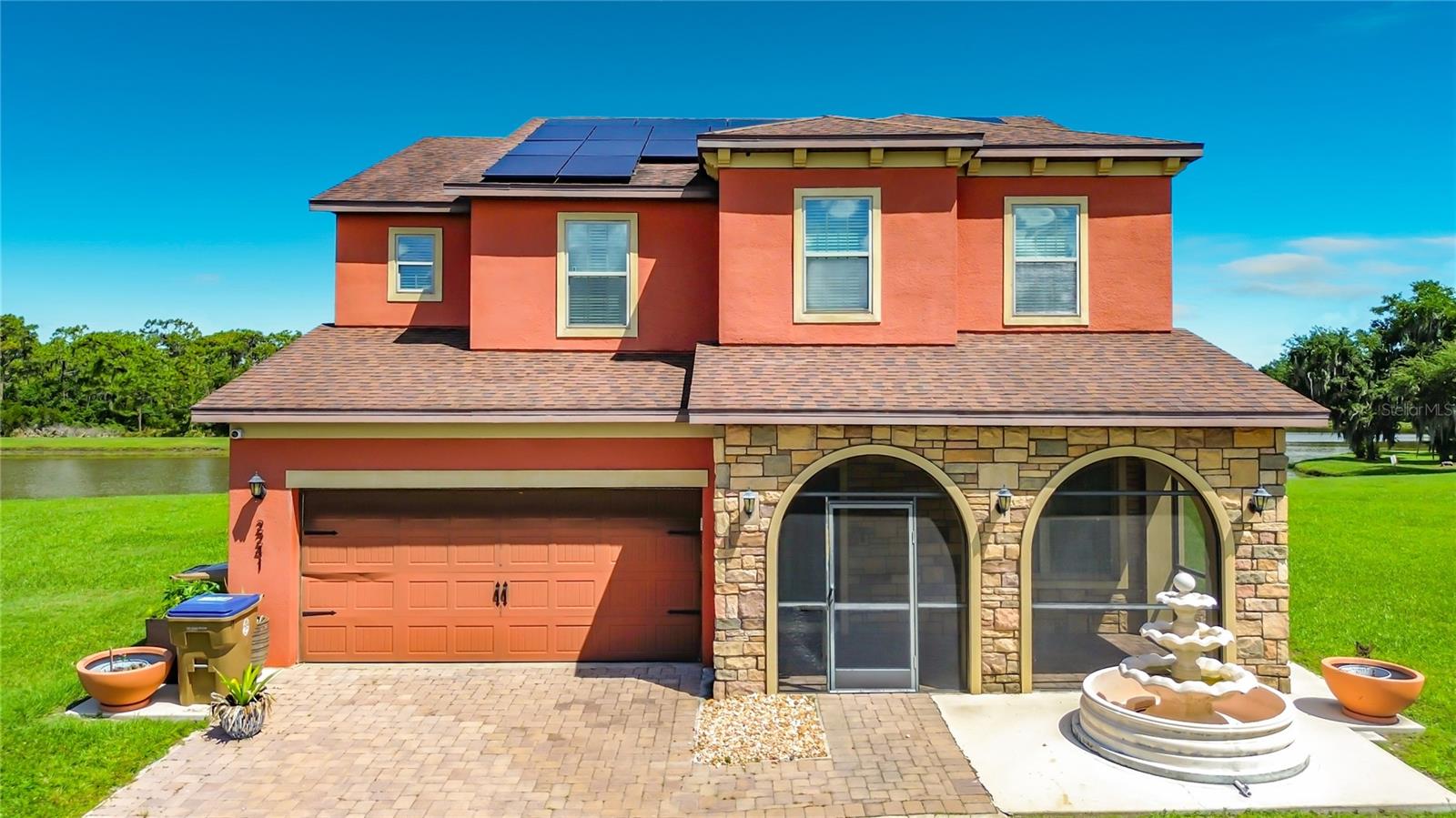 Welcome to Eagle Lake living in the heart of Kissimmee! Nestled in a quiet cul-de-sac, this stunning two-story home offers 4 spacious bedrooms, 2.5 bathrooms, a private pool, peaceful water views, and an oversized lot that delivers the perfect blend of privacy, comfort, and endless potential. One of the home’s most unique features is its breathtaking backyard setting. The property backs up to Eagle Lake and a protected preserve that cannot be built on, offering long-term privacy and uninterrupted natural views. The preserve connects directly to beautiful Lake Tohopekaliga (Lake Toho), creating a serene and scenic backdrop that truly captures the beauty of Florida living. Inside, you’ll fall in love with the beautifully updated kitchen featuring modern finishes, ample counter space, and an open-concept layout designed for entertaining family and friends. The home also includes solar panels, helping provide energy efficiency and long-term savings for years to come. Step outside and imagine creating your own private outdoor oasis. Whether you envision an expanded screened-in lanai, outdoor kitchen, tropical landscaping, basketball court, garden retreat, or resort-style entertaining space around the pool, this oversized lot provides endless possibilities with a little imagination. Best of all, much of the hard work has already been done, allowing the next owner to simply personalize and elevate the space to fit their vision. Enjoy peaceful mornings with coffee overlooking the water, unforgettable weekend BBQs by the pool, and relaxing evenings surrounded by nature and tranquil preserve views. This home offers the rare opportunity to enjoy privacy, space, and the Florida lifestyle all in one exceptional property. Owner will consider deferred maintenance credits with the right offer.