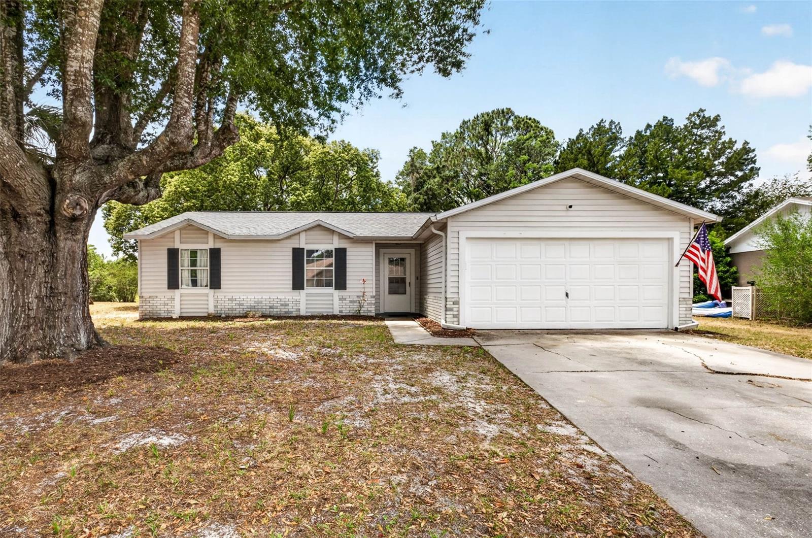 Set on over half an acre with serene conservation views, this updated 3-bedroom, 2-bath home offers room to spread out inside and out. This well-maintained home features a 2-car garage, laminate flooring throughout, and an updated kitchen with modern finishes and plenty of space for everyday cooking and entertaining.The comfortable living areas flow nicely into the Florida room, creating extra space to relax, unwind, or enjoy the peaceful natural backdrop year-round. Step outside and take advantage of the oversized .56-acre lot with plenty of room for outdoor living, gardening, pets, play, or future possibilities. With no rear neighbors and a beautiful conservation setting, this property offers the perfect blend of comfort, privacy, and Florida living. Conveniently located near shopping, dining, parks, schools, and Gulf Coast recreation, 13205 Wagner Dr is a wonderful opportunity in Hudson. Additional peace of mind comes with major system updates, including HVAC 2020, water heater 2022, and roof 2026.