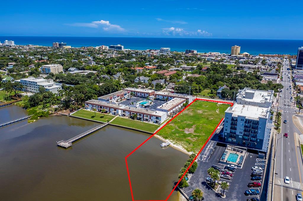 613 & 618 Halifax present a two-parcel assemblage totaling 53,268.5 square feet (±1.22 acres) in the core redevelopment corridor of Daytona Beach. The primary site at 613 Halifax consists of 41,768.5 square feet with dimensions of 123' x 361' and offers 132 linear feet of direct Intracoastal water frontage. The adjacent parcel at 618 Halifax adds an additional 10,500 square feet and is included in the sale, creating a combined development footprint with increased flexibility and scale. The property is zoned BPUD and was previously approved for a 36-unit condominium development with 39 marina boat slips, providing a strong precedent for future development potential. Positioned at the base of the Seabreeze Bridge within the city's tourist district, the site benefits from high visibility and proximity to beach access, retail, and hospitality.
This offering is well suited for developers seeking a large-scale waterfront opportunity in an active redevelopment area. Owner financing is available for qualified buyers, and joint venture opportunities will be considered.