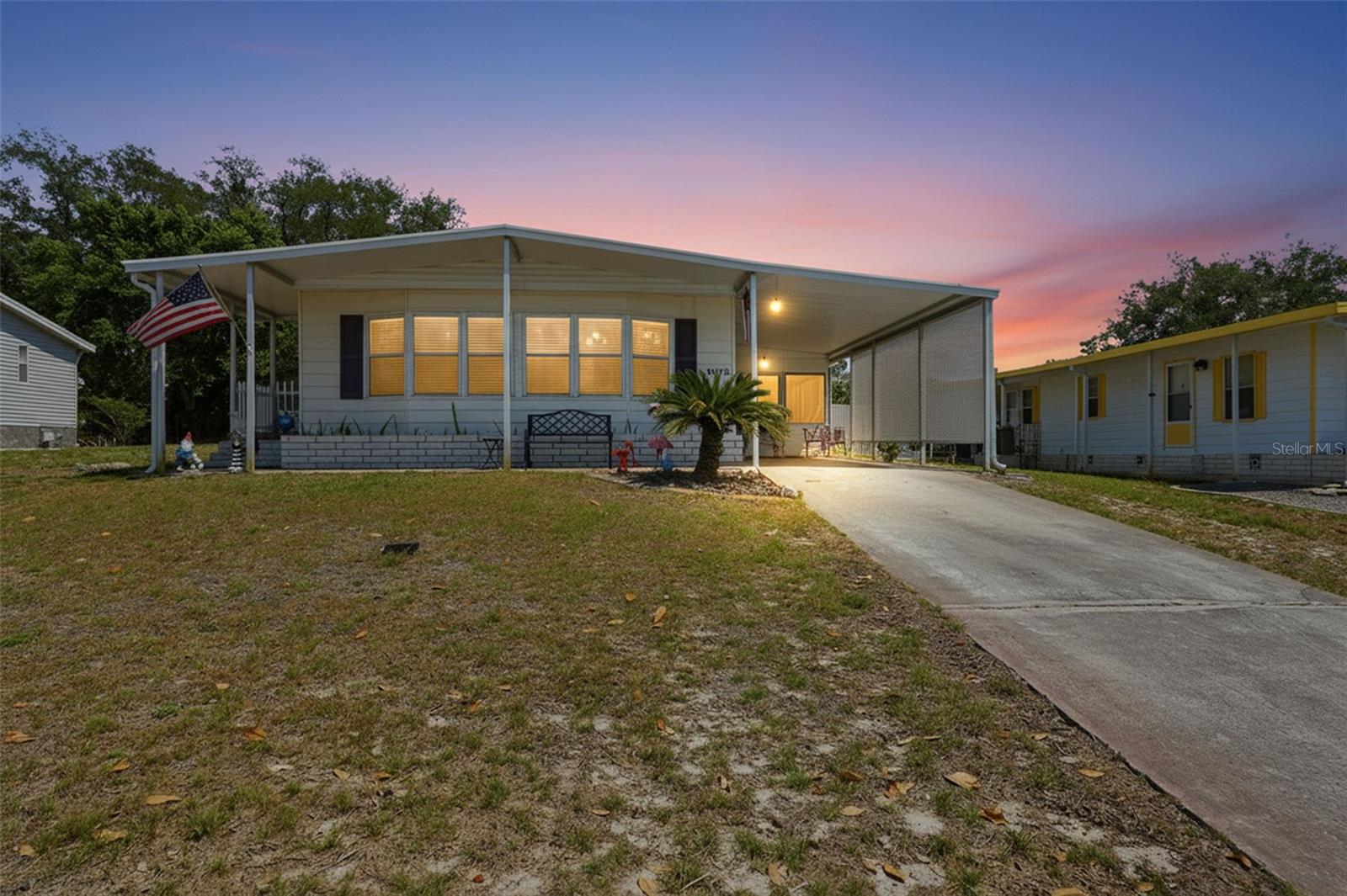 Freshly painted exterior, elevated positioning well above road grade, and ample parking with a one-car carport and an extended driveway. No Flood zone (x), no CDD and a very low HOA ($55 a month) with a lot of amenities!  Welcome to 15080 Rialto Ave located in 55+ golf community of Brookridge where you own your own land! 
Step inside into the kitchen featuring solid wood cabinetry with 12 cabinets, a pantry for added storage, and all major appliances including refrigerator, stove, and dishwasher. An eat-in countertop opens to the living room, creating the perfect space to enjoy your morning coffee while staying connected to the main living area.
Just off the kitchen, the dining room showcases a charming built-in cabinet with a mix of traditional and glass-front storage—ideal for a coffee bar, display space, or entertaining essentials. The home flows into the living room, where luxury vinyl plank flooring extends throughout the main living areas, offering both durability and modern appeal.
Down the hallway, you’ll find a guest bathroom complete with a tub/shower combination. The secondary bedroom, located at the end of the hall, features a walk-in closet and cozy carpet. The spacious primary suite offers its own private retreat with an en suite bathroom, designed with a separate sink area apart from the tub/shower, and toilet for added convenience. Sliding glass doors lead directly from the primary bedroom to a relaxing enclosed porch.
The enclosed porch provides additional versatile living space and connects to the garage, making it perfect for indoor-outdoor living. Just outside, unwind in your private Jacuzzi—available as a negotiable feature for buyers if you want it! FULLY FENCED YARD!
Additional upgrades include all new FLOORING, a brand-new AC SYSTEM, and a NEW VAPOR BARRIER for peace of mind. The home is outfitted with faux wood blinds and curtains throughout, adding both style and privacy. A storage shed is also included, offering extra space for tools and equipment.

Located in a 55+ community with 24/7 security guard as well as gated around the entire neighborhood. 18-hole par 72 Golf Course, tennis, shuffleboard, pickleball,  putting green, horseshoes, bocce court, heated community pool, Sauna, community club house, fitness center, shuffleboard, picnic areas, and so many more activities for you to enjoy INSIDE the community! Outside the community it is close to banks, shopping, dining, hospitals, doctor offices, Suncoast Parkway, natural springs and rivers and marinas, Weeki Wachee Springs, Pine Island Beach, Public Boat Ramps that go out to the Gulf of Mexico, Spring Hill, Public Golf Courses, Public Parks, Hiking trails, biking trails, and the outlet malls are only 45 minutes away! Bring your golf cart and start living the Florida Life today!