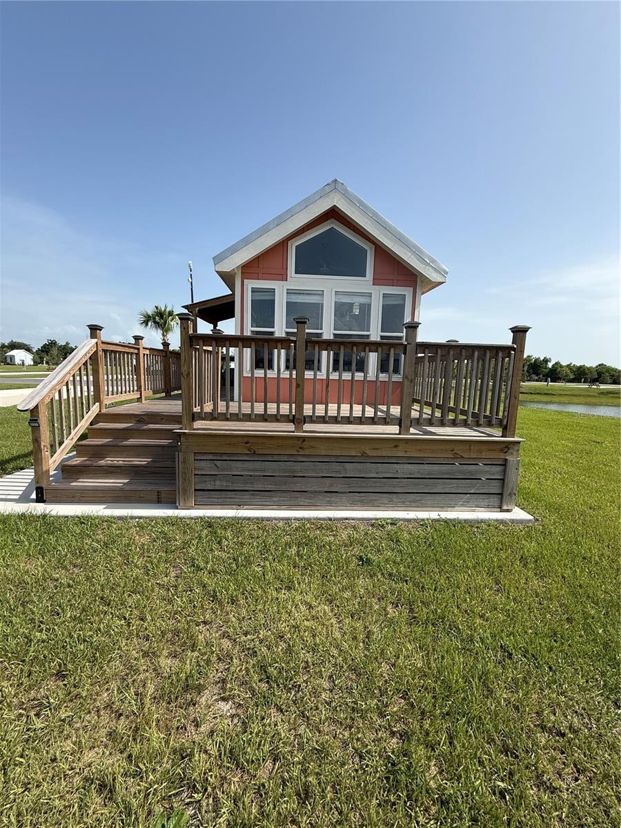 Own your own piece of paradise with this pretty waterfront TINY HOME at this beautiful new luxury RV resort at Palm Breeze in Punta Gorda located just minutes from pristine beaches, waterfront restaurants, and endless coastal attractions. Enjoy resort-style living with outstanding amenities, including a stunning swimming pool, relaxing hot tub, and our lively Tiki Bar featuring entertainment and social events. Stay active with pickleball, bocce ball, a putting green, playground, and spacious dog parks. Additional conveniences include an on-site café, laundry facilities, and much more. This perimeter lot with no back neighbors offers added privacy with no rear neighbors, creating the perfect setting to relax and unwind. Waterfront lots are also available for those seeking breathtaking views. Whether you're looking for a seasonal retreat, vacation getaway, or investment opportunity, this luxury RV resort offers the ideal blend of comfort, recreation, and coastal living.