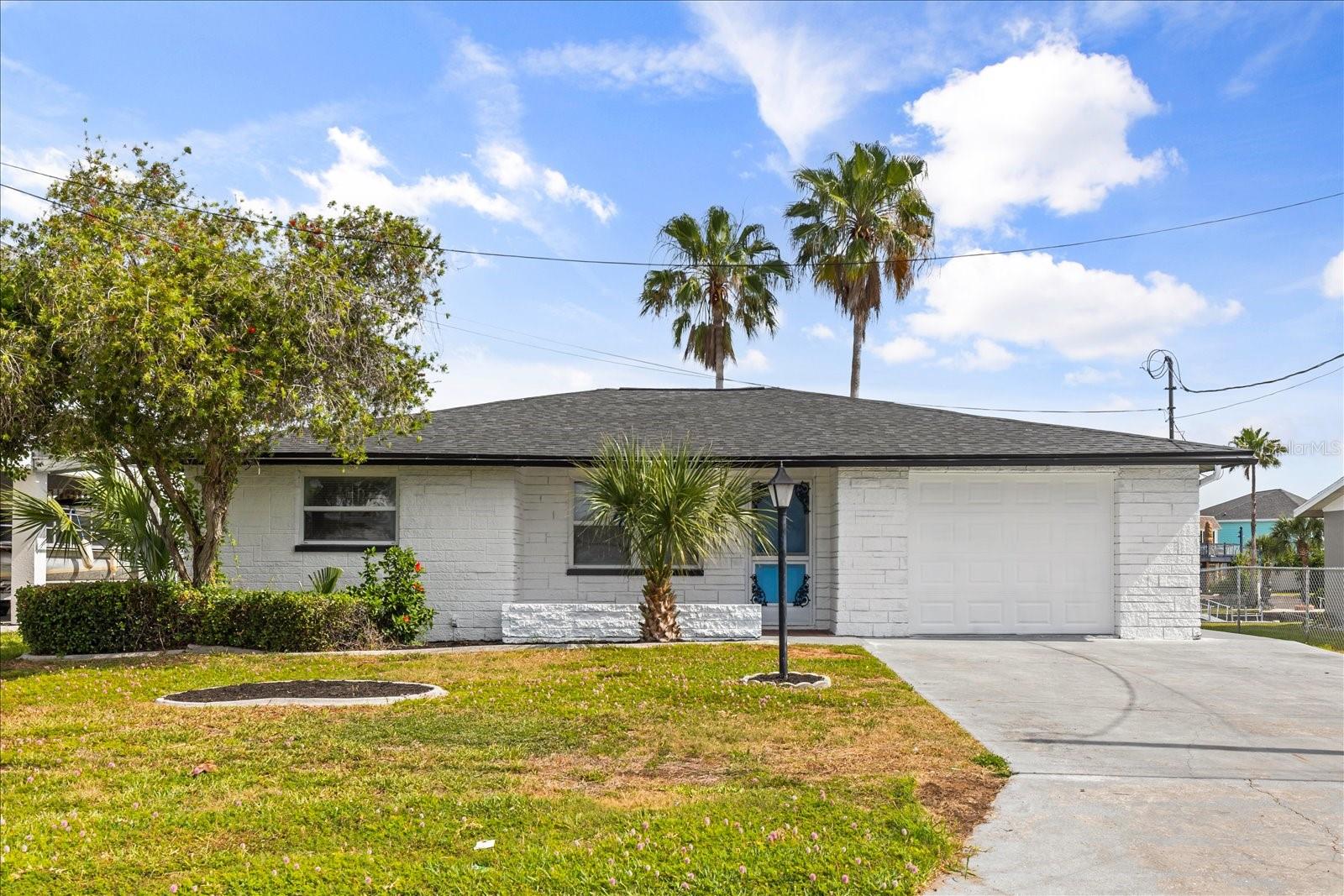 Waterfront living at its finest! This beautifully renovated 2-bedroom, 2-bath home in Hernando Beach offers direct Gulf access with 62 feet of saltwater canal frontage and no bridges—a true boater’s dream. Step inside to discover a completely updated interior featuring a brand-new roof, fresh interior and exterior paint, and stylish tile flooring throughout. The stunning open kitchen showcases white shaker cabinetry, granite countertops, stainless steel appliances, and a breakfast bar that flows seamlessly into the dining and living areas—perfect for entertaining. Both bathrooms have been fully remodeled with modern vanities and new shower/tub features. Additional upgrades include a new hot water heater and garage door, providing peace of mind for years to come. Enjoy relaxing water views from the Florida room or unwind on the screened rear porch overlooking the canal. Whether you're sipping your morning coffee or hosting guests, this home is designed to embrace the coastal lifestyle. Located in a golf-cart-friendly community, Hernando Beach offers a laid-back atmosphere with nearby boat ramps, parks, nature preserves, and waterfront dining with live music. You're just minutes from Pine Island Beach and within easy reach of Tampa International Airport, Clearwater, and St. Petersburg for shopping, dining, and entertainment. Don’t miss your chance to own this turnkey waterfront retreat—schedule your showing today! All information recorded in the MLS is intended to be accurate but cannot be guaranteed, buyer advised to verify. Sold As-Is.”