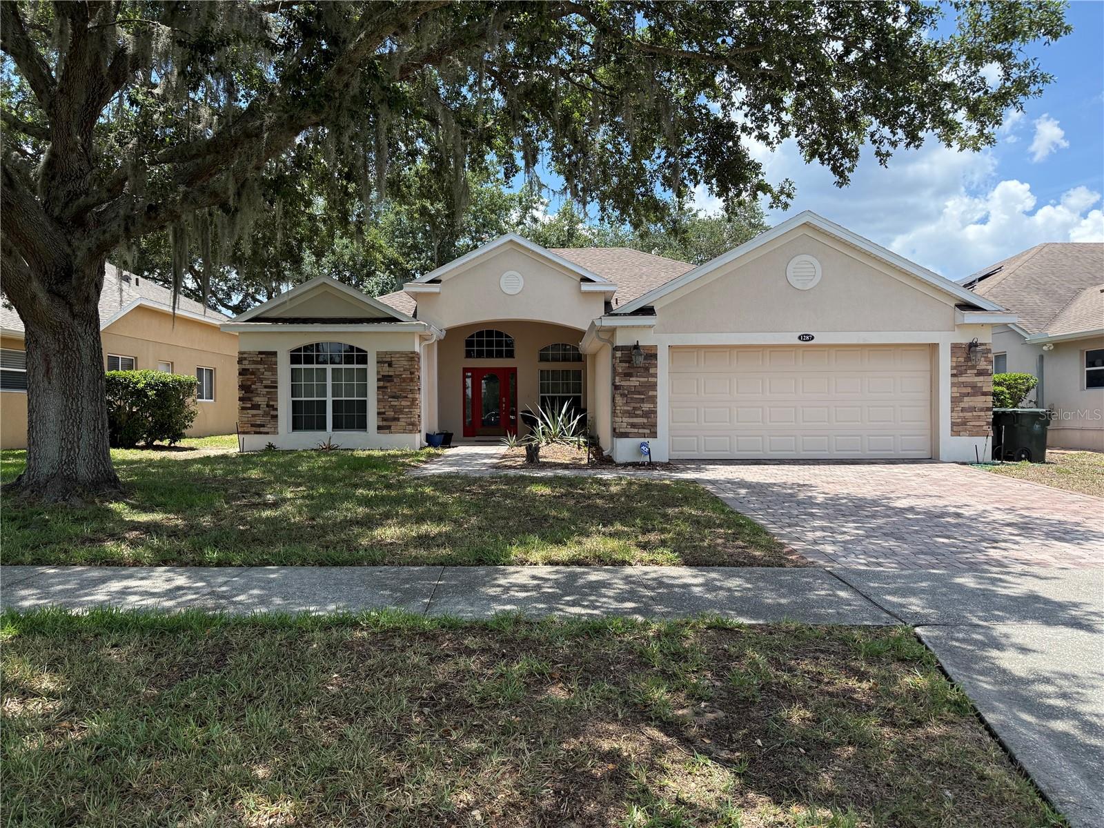 Welcome to this spacious 3-bedroom, 3-bathroom home located in the highly sought-after guard-gated golf community of Legends in Clermont. Offering a versatile floor plan and endless potential, this home presents a wonderful opportunity to personalize and create the home you've always envisioned.Inside, you'll find formal living and dining rooms that provide the perfect setting for entertaining, while the open-concept kitchen and family room offer a comfortable space for everyday living and gathering with family and friends. The oversized primary suite serves as a private retreat, complete with direct access to the screened back porch and a generously sized ensuite bath. A rare second ensuite bedroom provides ideal accommodations for guests, extended family, or multigenerational living.The den/home office offers additional flexibility and can easily be transformed into a fourth bedroom, hobby room, or dedicated workspace to fit your lifestyle.While the home is ready for cosmetic updates, it's the perfect canvas for buyers looking to add their own style and finishes while building instant equity in one of Clermont's most desirable communities. Major improvements have already been completed, including a brand-new A/C system (2026) and a new roof (2024), allowing you to focus on making the space uniquely yours.Enjoy relaxing on the screened back porch and take advantage of the exceptional amenities Legends has to offer, including a championship golf course, clubhouse, fitness center, resort-style pool, tennis courts, playground, and more. Conveniently located near shopping, dining, top-rated schools, and major roadways, this home combines outstanding potential with an unbeatable lifestyle opportunity.