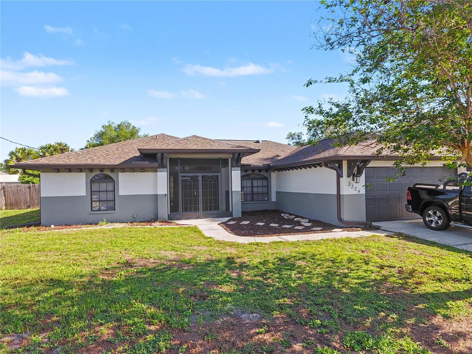 ½-Acre Lot + City Water! Space, flexibility, and room to expand in this desirable property in North Port.
This 3-bedroom, 2-bath, 2-car garage home sits on an oversized ½-acre lot, offering opportunities not found on typical homesites. With plenty of room to add a detached garage, workshop, RV or boat storage, or even a second driveway with rear access, this property is ideal for buyers needing extra space and future potential.
Inside, the home features all tile flooring and high cathedral ceilings, creating a bright and open feel. The split-bedroom floor plan provides privacy, while the kitchen includes wood cabinetry, a breakfast bar, and a closet pantry.
The spacious primary suite offers two walk-in closets and an en-suite bathroom with dual sinks, a jetted tub, and a walk-in shower. French doors lead to a large Florida room with vinyl windows that slide open to catch the breeze or close for year-round use, providing flexible additional living space. The third bedroom also features a walk-in closet.
Additional features include a new roof in 2023, hurricane shutters, and electric roll-down shutters on the front entry and rear lanai.
If you’ve been searching for a property with extra space and the ability to expand or customize, this home offers the flexibility to fit your lifestyle. Property qualifies for VA and FHA Financing.