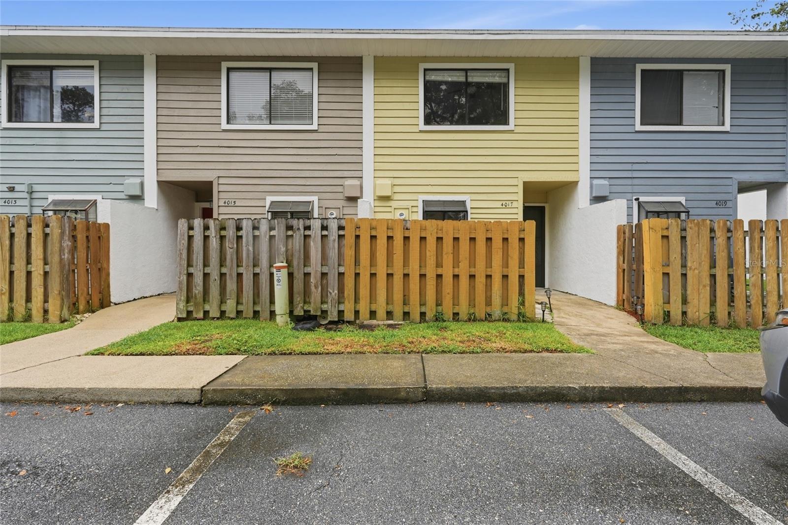 Are you searching for a nicely renovated townhome in an unbeatable location? You found it! This immaculate 2-bedroom, 1.5-bath townhome has been tastefully updated and is nestled within the desirable Millrun community. From the moment you arrive, you'll appreciate the well-maintained exterior, with siding, exterior paint, and roof replacement all handled by the HOA. Step inside to discover newer luxury vinyl plank flooring, an updated kitchen featuring stainless steel appliances, a breakfast bar, abundant cabinet space, and an inviting dining area that flows into the spacious living room. Adjacent to the dining room is a conveniently located half bath. Beyond the living room is a spacious screened in porch which opens to a fully fenced in backyard space. Upstairs, you'll find two generously sized bedrooms and a beautifully updated shared bathroom with a tub/shower combination. Whether you're searching for your first home or an investment property, this townhome checks all the boxes. Conveniently located just minutes from Butler Plaza, Celebration Pointe, the University of Florida, UF Health, shopping, restaurants, and on the main bus route, you'll love the accessibility to everything Gainesville has to emjoy. Don't miss your opportunity to call this move-in-ready townhome your own. Schedule your private tour today!