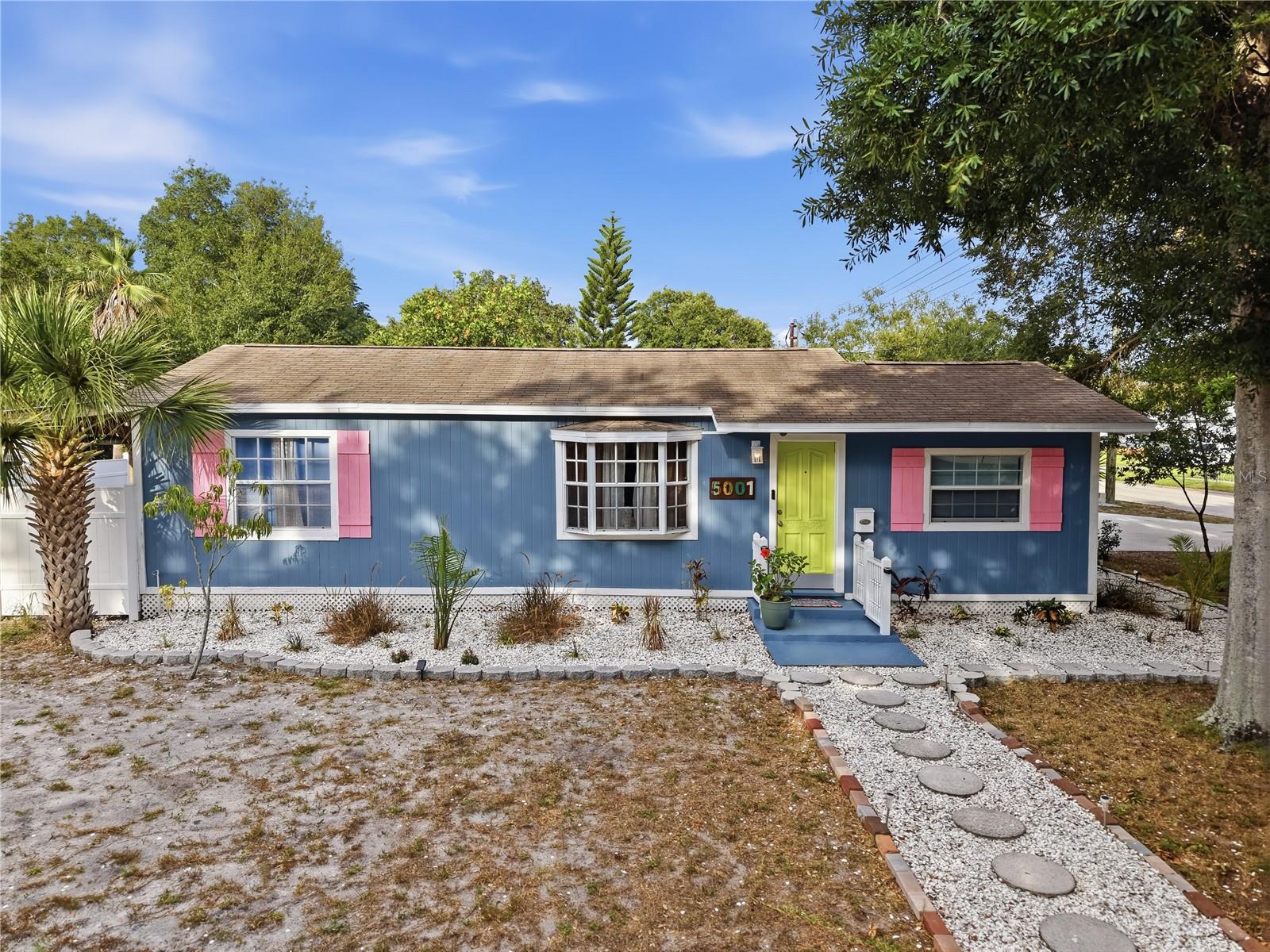 Welcome to this warm and inviting home ideally located near Harris Park and just minutes from Downtown St. Pete. Situated on a corner lot in a desirable non-flood zone with no HOA, this well-maintained property offers the perfect blend of classic charm, thoughtful improvements, and an unbeatable location.

Officially a 2-bedroom, 1.5-bath home, the existing half bath has been enhanced with an added shower for additional bathing convenience. Furthermore, the interior has been freshly painted and features beautiful original hardwood floors, all new window blinds, updated light fixtures and ceiling fans throughout, a brand-new refrigerator, and a new washer and dryer—making it easy to move right in while still leaving room to add your own personal style over time.

The spacious backyard is fully enclosed with a brand-new vinyl privacy fence, creating an ideal space for pets, entertaining, gardening, or simply enjoying the Florida sunshine. A custom mural adds personality to the outdoor shower area, creating a fun and unique backyard retreat.

One of this property's standout features is the recently constructed detached two-car garage, offering exceptional storage, workshop space, or secure parking. Combined with an oversized driveway that accommodates up to six vehicles, there's plenty of room for cars, boats, trailers, or guests.

Whether you're a first-time homebuyer, downsizing, relocating to St. Petersburg, or searching for a home with room to grow, you'll appreciate the combination of a generous corner lot with fully fenced backyard, no HOA, non-flood zone, detached garage, abundant parking, and a location just minutes from Downtown St. Pete, Harris Park, shopping, restaurants, beautiful Gulf beaches, and convenient access to I-275.

Homes offering this much flexibility, parking, and outdoor space in such a central St. Petersburg location are hard to find. Come experience the comfort, character, and possibilities this special property has to offer.