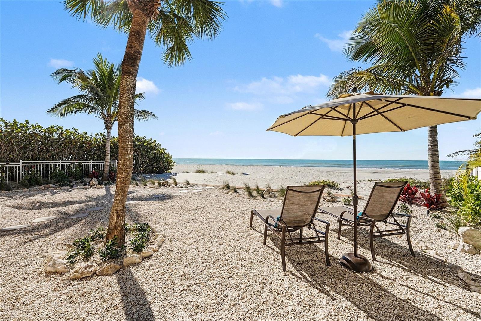Virtually Staged. WITH THIS SIGNIFICANT PRICE IMPROVEMENT,  you can own one of the largest and most versatile Gulf-front properties available, situated on an expansive 63' x 203' (.39-acre) beachfront lot. This exceptional Gulf-front property offers direct access to a private stretch of pristine beach. Its incredible value, privacy, and future potential, the property is zoned for up to five units (buyer to verify), creating endless possibilities for expansion, redevelopment, income production, or to enjoy a second home and a legacy beachfront estate.
Lovingly maintained by the same family for decades, this solid concrete residence combines durability with thoughtful modern updates, including storm-rated PGT custom windows and doors, new tropical landscaping, enhanced landscape lighting, and a private gated entrance with custom remote-controlled access. Designed for multi-generational living, guest accommodations, or rental flexibility, the home features two separate condo-style residences, each with private entrances and breathtaking Gulf views.  With the size of the lot, there is plenty of room for a pool with views of magnificent sunsets.

The fully renovated lower level (2025) offers 2 bedrooms and 2 bathrooms, showcasing updated electrical, new flooring, fresh paint, custom cabinetry throughout the kitchen, baths, and laundry room, stunning quartzite countertops, an oversized island, dual A/C units, Plantation Shutters, remote-controlled shades, and a luxurious primary bath with an oversized jetted tub. The upper level serves as a private coastal sanctuary with 3 bedrooms, 2 bathrooms, two private balconies capturing Gulf and partial Intracoastal views, a spacious living area with an electric fireplace, granite kitchen countertops, a high bar, separate utility room, fresh paint, Plantation Shutters, and remote-controlled shades.

Filled with natural light from oversized windows, the open-concept design captures spectacular sunsets, coastal breezes, and panoramic Gulf and beach views from both levels. Whether you're seeking a primary residence, vacation retreat, income-producing property, or redevelopment opportunity, this one-of-a-kind beachfront offering delivers unmatched flexibility and investment potential. Conveniently located near top-rated restaurants, medical facilities, schools, major interstates, and two international airports, this rare property is where luxury coastal living, long-term value, and future possibilities converge.  Call for your private showing today and make this home your Florida retreat!
