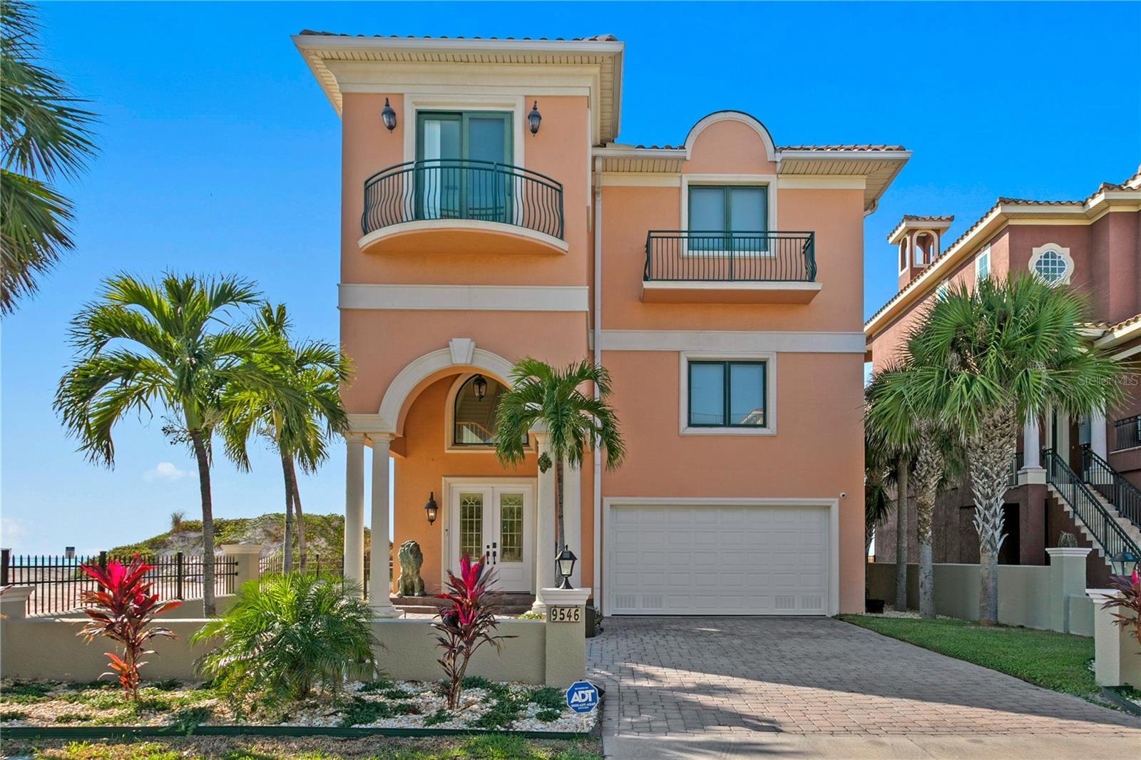 Experience the ultimate in direct-on-the-sand beachfront living, positioned on the newly replenished white sand beaches of Treasure Island. This exceptional Gulf-front residence delivers breathtaking sunsets, nonstop coastal views, and an unbeatable location at a price point rarely seen for beachfront of this caliber. Built in 2006 with solid concrete block construction, the home offers 4,870 square feet of interior living space and 8,007 square feet total, thoughtfully designed for luxury living and high-level entertaining. The expansive layout features five bedrooms, five full baths and a half bath, with all bedrooms en suite, along with a den/library and generous living, kitchen and dining spaces that flow seamlessly together. The kitchen is equipped with two dishwashers, ideal for hosting large gatherings, while the living room is anchored by a fireplace and sweeping Gulf views. Additional highlights include a private elevator, oversized 1210-square-foot garage, balconies on every level, and a fenced outdoor entertaining area with a pool and heated spa. Recent upgrades include new landscaping, fencing, balcony railings, a new spa water heater and two elevated HVAC systems. With its unmatched beachfront positioning, strong rental and income potential, and iconic Treasure Island sunsets, this is a rare Gulf-front opportunity, and an absolute steal in today’s market.