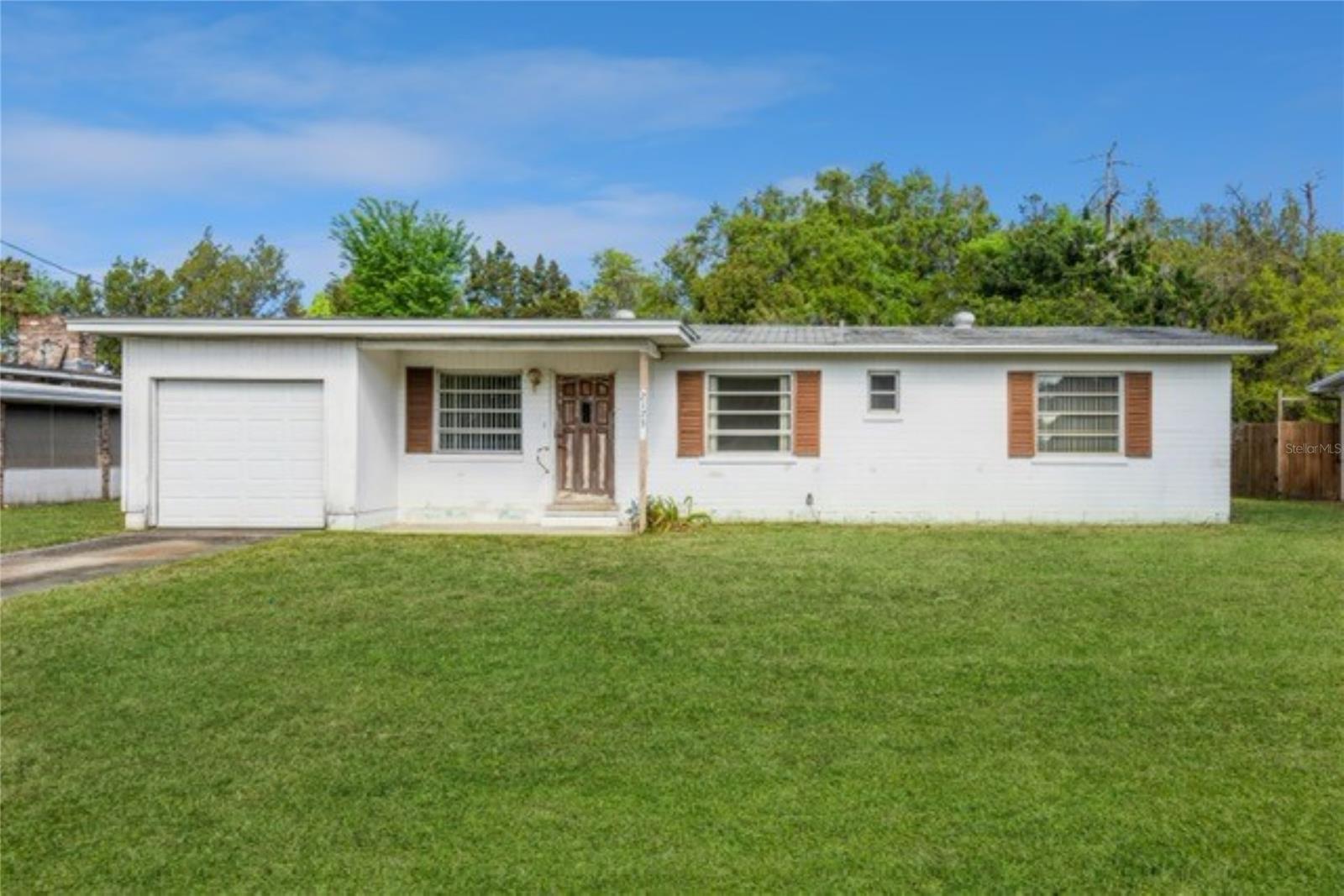 Located in New Smyrna Beach this quaint home is tucked away on a Lazy Street in the Corbin Park district.  An ideal location close to shopping, restaurants and I-95 for easy commuting. Featuring 3 Bedrooms, 2 Full Bathrooms, Living Room, Kitchen with Breakfast Room, Charming Florida Room and a 1 Car Garage. An opportunity is presenting itself to improve this single family home for personal use, investment, rental, short term or second home. Call for details.