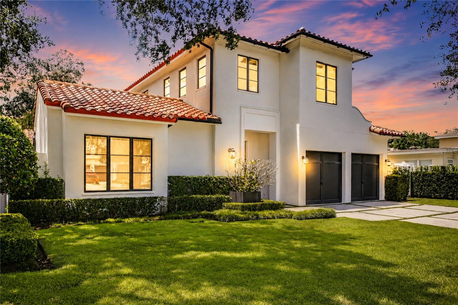 Positioned in one of Winter Park's most coveted neighborhoods, this exceptional French Mediterranean residence is just moments from Phelps Park, the Winter Park YMCA, Lakemont Elementary, and Interlachen Country Club. Designed by WP Design with interiors by Wolfe Rizor Interiors, the home blends timeless architecture with refined contemporary interiors, emphasizing natural light, clean lines, and exceptional craftsmanship.

The residence offers 4 bedrooms, 4 full bathrooms, and 1 half bathroom within a thoughtfully designed floor plan. The first-floor primary suite is complemented by a secondary downstairs bedroom that also functions as a private office, nursery, fitness room, or guest suite. The spa-inspired primary bathroom leads to an expansive custom walk-in closet with dedicated his-and-her wardrobe areas. Positioned on the opposite wing of the home, the private guest suite features its own full bathroom, a generous walk-in closet, and direct access to the pool and outdoor living area, great privacy for guests or extended family.

The chef's kitchen features a generous center island, custom cabinetry, and premium finishes serve as the centerpiece of the home. Oversized glass doors open to a covered lanai featuring a fully equipped outdoor kitchen and pool.

Every detail reflects a commitment to quality, from the carefully selected finishes to the precision of the construction. Set along a quiet, oak-lined street, this residence presents a rare opportunity to own a beautifully executed custom home in the heart of Winter Park.