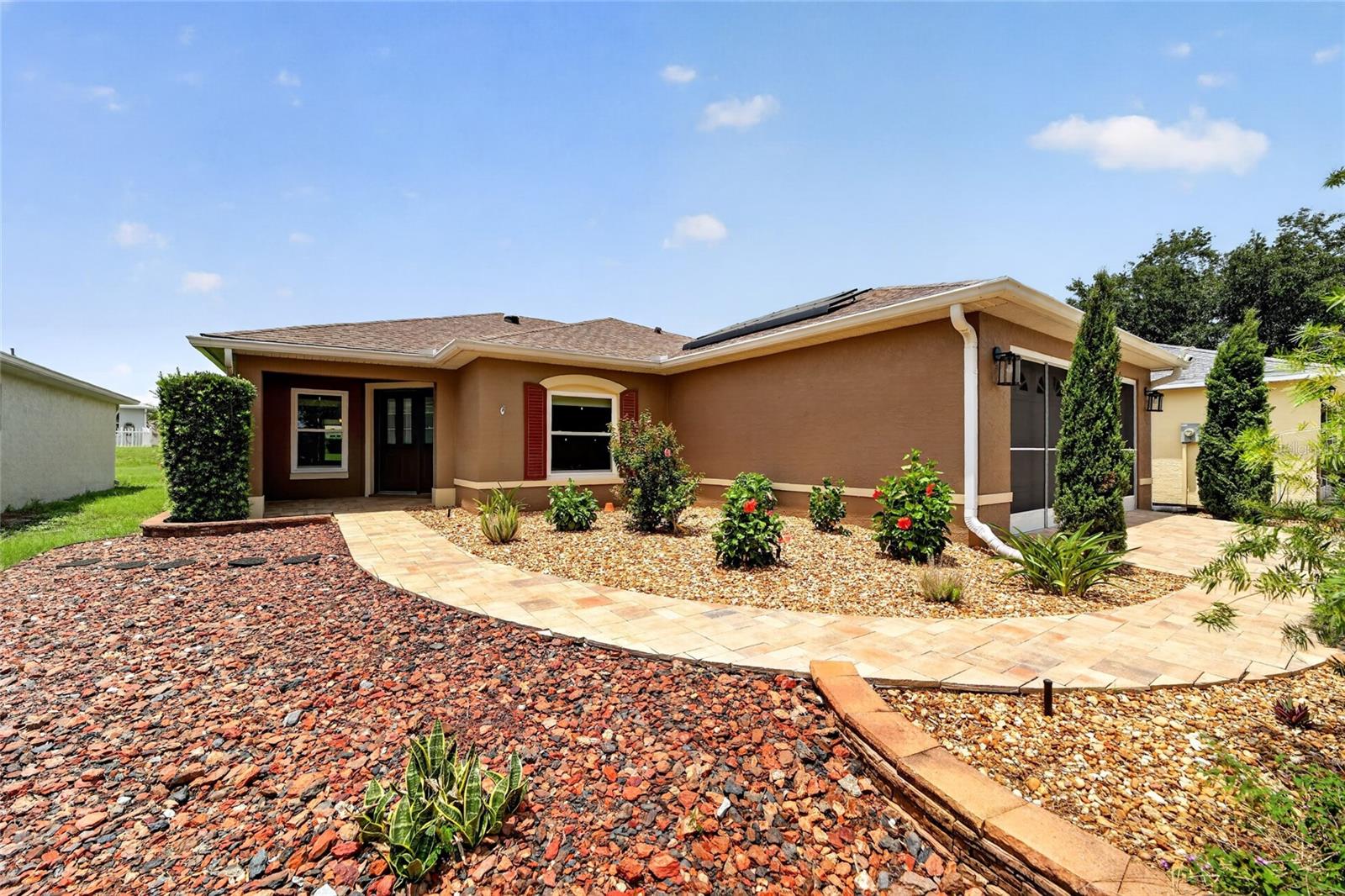 The Expensive Updates Are Behind You. The Enjoyment Is Ahead of You.

Roof (2021), HVAC (2022), and 20 roof-mounted solar panels installed in 2024—with the solar loan paid off by the seller at closing.

A paver driveway welcomes you home to this Wakefield model offering 2 bedrooms, 2 bathrooms, a den/flex room, and a 2-car garage—a home designed to be enjoyed from the day you move in.

The kitchen features staggered cabinetry, granite countertops, black stainless appliances, a gas range, and generous cabinet and counter space. Luxury vinyl plank flooring extends throughout the home, complemented by updated lighting, replacement windows, and tastefully updated bathrooms for a fresh, inviting feel.

The den offers flexible space for a home office, hobby room, library, or TV room, while the former screened lanai has been professionally enclosed to create a bright Florida Room you'll enjoy year-round.

Additional features include a gas dryer and gas hot water heater, adding to the home's efficiency and everyday convenience.

Located in On Top of the World, you'll enjoy golf cart access to three golf courses, multiple pools, fitness centers, pickleball and tennis courts, walking trails, hobby and craft studios, restaurants, entertainment, shopping, and medical facilities.

Move in, unpack, and start enjoying everything On Top of the World has to offer.