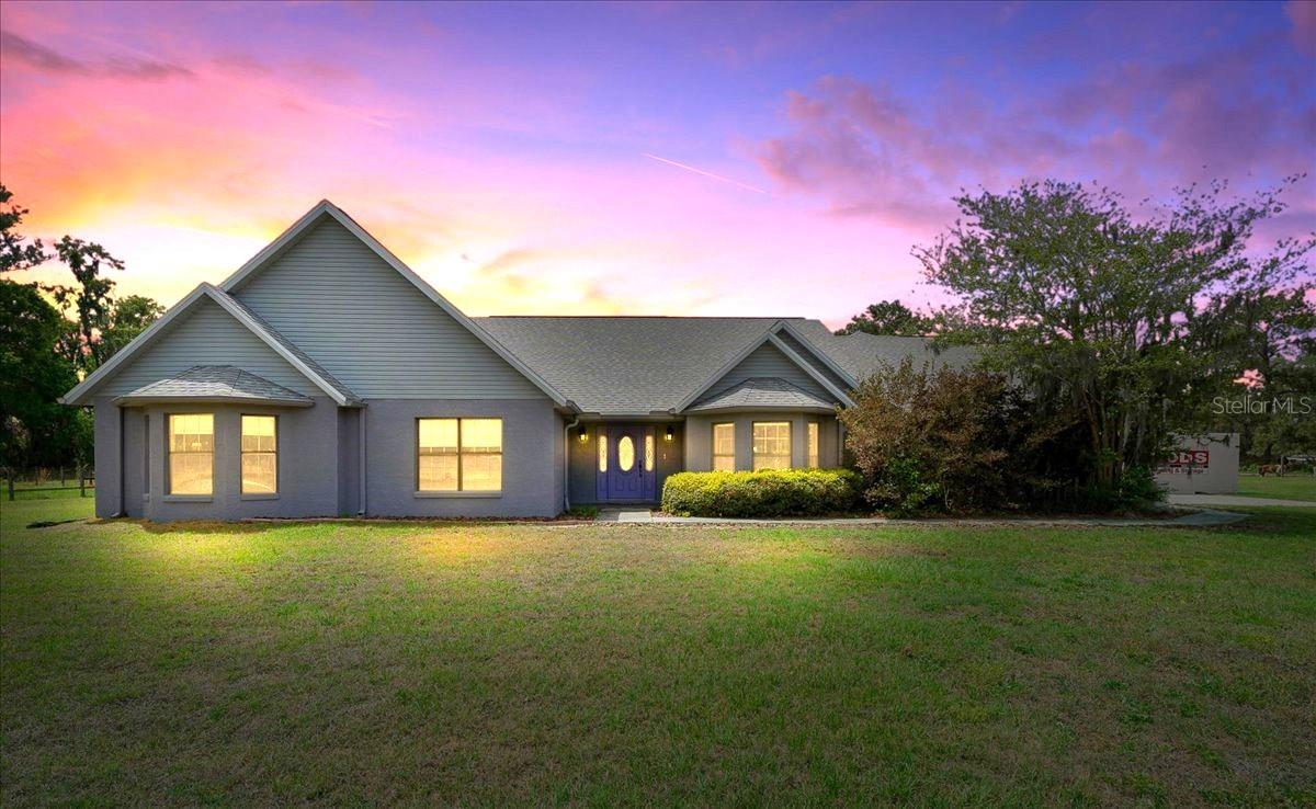This beautifully maintained custom-built home offers the perfect blend of comfort, functionality, and upgraded living on a well-appointed property. Designed with a thoughtful split floor plan, the home features spacious living areas, cathedral ceilings, and seamless indoor-outdoor flow with triple sliding doors leading to a screened pool and expansive lanai.
The modern kitchen is equipped with Jetta Stone countertops, tall cabinetry, a breakfast bar, and a bright breakfast nook overlooking the pool area—ideal for both everyday living and entertaining. The main living space includes a custom-built entertainment center, while the formal dining area features a bay window and elegant finishes.
The private owner’s suite serves as a relaxing retreat with a tray ceiling, built-in speaker system, French doors to the pool, and a spa-inspired bathroom complete with Jetta Stone countertops, a luxury jetted soaking tub, and a separate walk-in shower.
Outdoor living is equally impressive, featuring a screened 11’ x 24’ in ground pool with updated equipment including a Hayward VS TriStar 900 pump and Jandy sand filter, along with a fully rescreened enclosure. The property also includes multiple fenced and gated pasture areas, a powered utility building, and extensive exterior improvements such as stadium lighting, gutters, and an upgraded gate system.
This home is loaded with major upgrades and modern systems, including a new roof (2022), whole-home Generac generator, on-demand gas water heater, Trane HVAC with zoning, water softener, security camera system, and Starlink high-speed internet equipment. Gas lines are already plumbed for a stove, outdoor grill, and standalone heater unit, and a 250-gallon underground propane tank is in place.
Additional features include a spacious 3 car garage with a work bench and shelving in place, a bonus storage room with closet maid shelving, and an additional entry door. The property is conveniently located approximately 20–25 minutes from the World Equestrian Center, offering both privacy and accessibility.
This exceptional property combines quality construction, thoughtful upgrades, and resort-style living—making it a rare opportunity in today’s market.