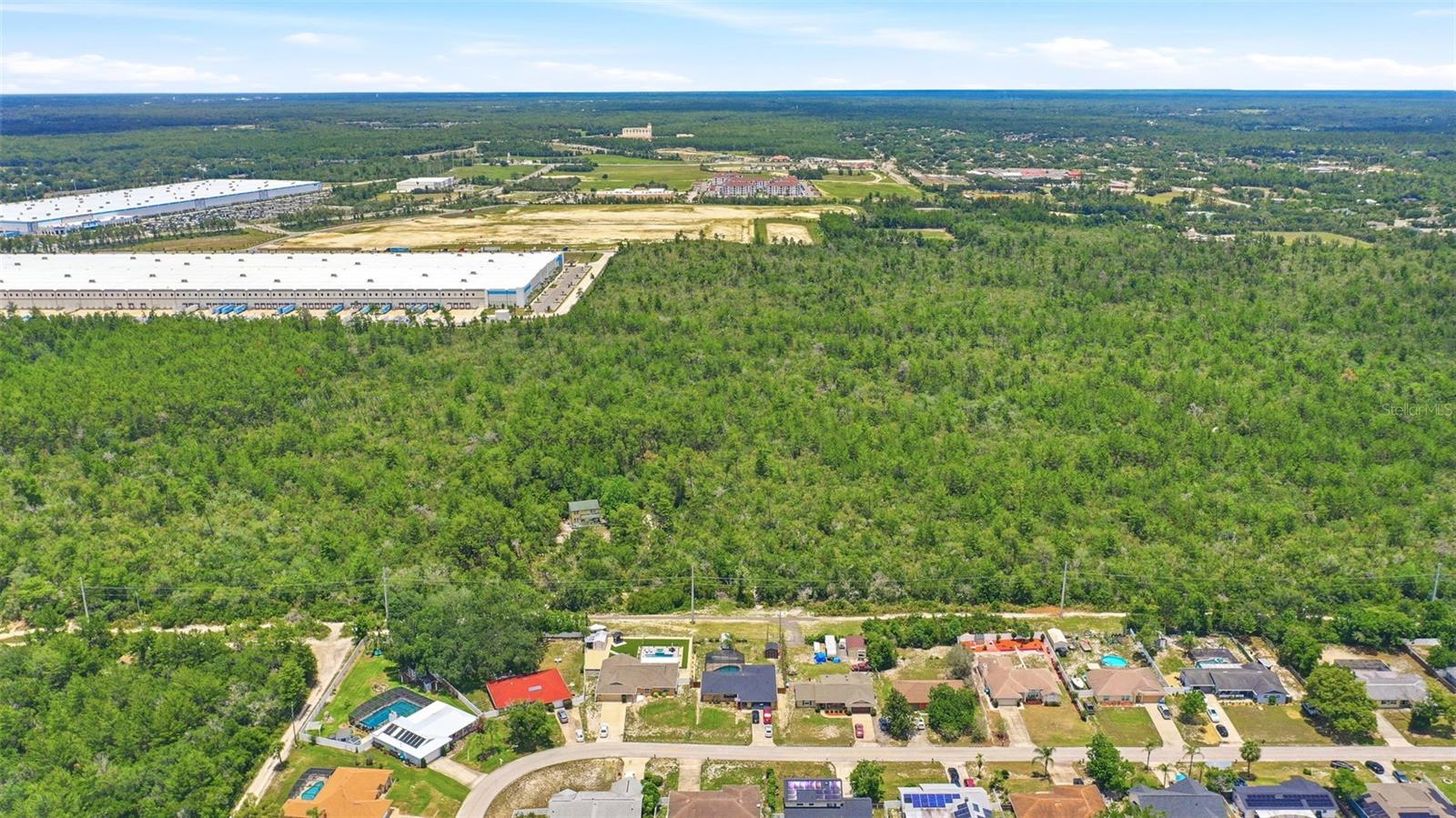 0.68 acre multi-family vacant land parcel located within Deltona’s Pine View Estates growth area. Deltona is the largest city in Volusia County and continues to experience strong residential expansion and economic growth, strategically positioned between Orlando and Daytona Beach.

Prime location parcel offering a flexible layout suitable for future multi-family development or long-term investment hold. Positioned in an active growth corridor with increasing demand for residential product, this site presents a strong opportunity for future positioning as the surrounding area continues to evolve.

Conveniently located minutes from I-4, Howland Boulevard, Halifax Health Medical Center, and Halifax Crossings Medical Village, providing direct access to major transportation routes, employment centers, and daily amenities.

The surrounding corridor is supported by major growth drivers including Amazon operations (approximately 500 employees), Synergy at Normandy, Deltona Village, and continued residential and commercial expansion. Planned SunRail extension further enhances long-term connectivity, workforce access, and regional demand strength.

Can be acquired individually or as part of a larger multi-parcel portfolio opportunity. Contact for more details.