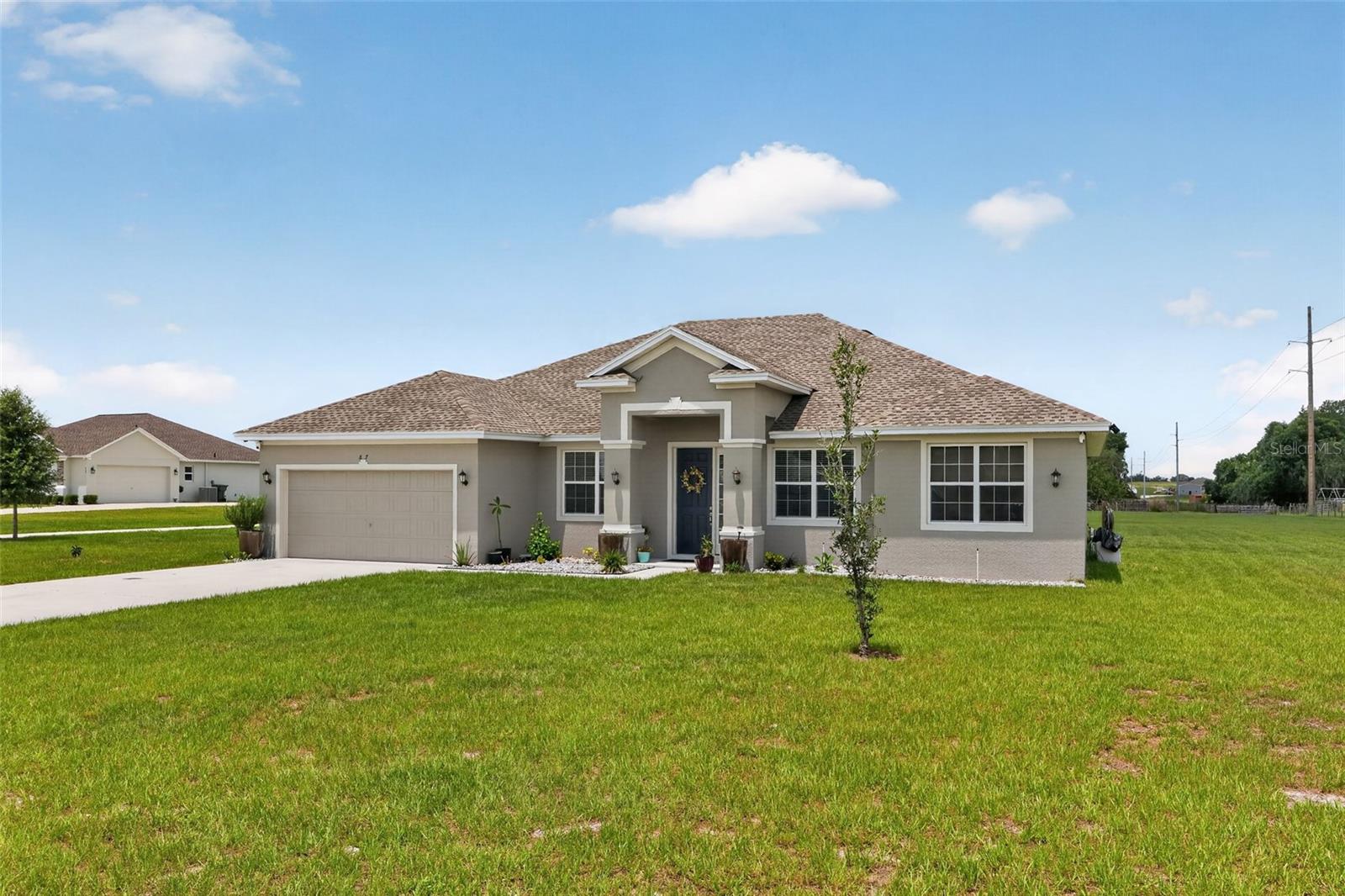 Welcome to 837 Liam Lane, a spacious and beautifully designed 4-bedroom, 3-bathroom home situated on more than half an acre in the growing city of Bartow. Offering the perfect combination of indoor comfort and outdoor space, this property provides room to spread out while enjoying a peaceful residential setting.

Step inside and discover a thoughtfully designed floor plan featuring generous living areas ideal for both everyday living and entertaining. The kitchen serves as the heart of the home and offers a cozy breakfast nook for casual meals, along with a separate dining room perfect for family gatherings, holiday celebrations, and entertaining guests.

The spacious layout includes four comfortable bedrooms and three full bathrooms, providing flexibility for families, guests, home offices, or multi-generational living. Large windows throughout the home fill the interior with natural light, creating a bright and welcoming atmosphere.

Step outside to the covered back porch, an ideal place to enjoy your morning coffee, relax after a long day, or host outdoor gatherings while overlooking your expansive backyard. With more than half an acre of land, there is plenty of room for pets, gardening, recreation, or future outdoor enhancements.

Located in Bartow, this home offers convenient access to shopping, dining, schools, medical facilities, and major roadways while maintaining a peaceful neighborhood feel. Nearby activities include boating and fishing on nearby lakes, golfing at local courses, exploring the scenic trails and parks throughout Polk County, visiting historic downtown Bartow, and enjoying family-friendly attractions throughout Central Florida. Residents are also within easy driving distance of Lakeland, Winter Haven, and the world-famous attractions of the Orlando area.

Whether you're looking for extra space, a functional floor plan, or a large homesite to enjoy the Florida lifestyle, 837 Liam Lane offers an outstanding opportunity to call this beautiful property home.