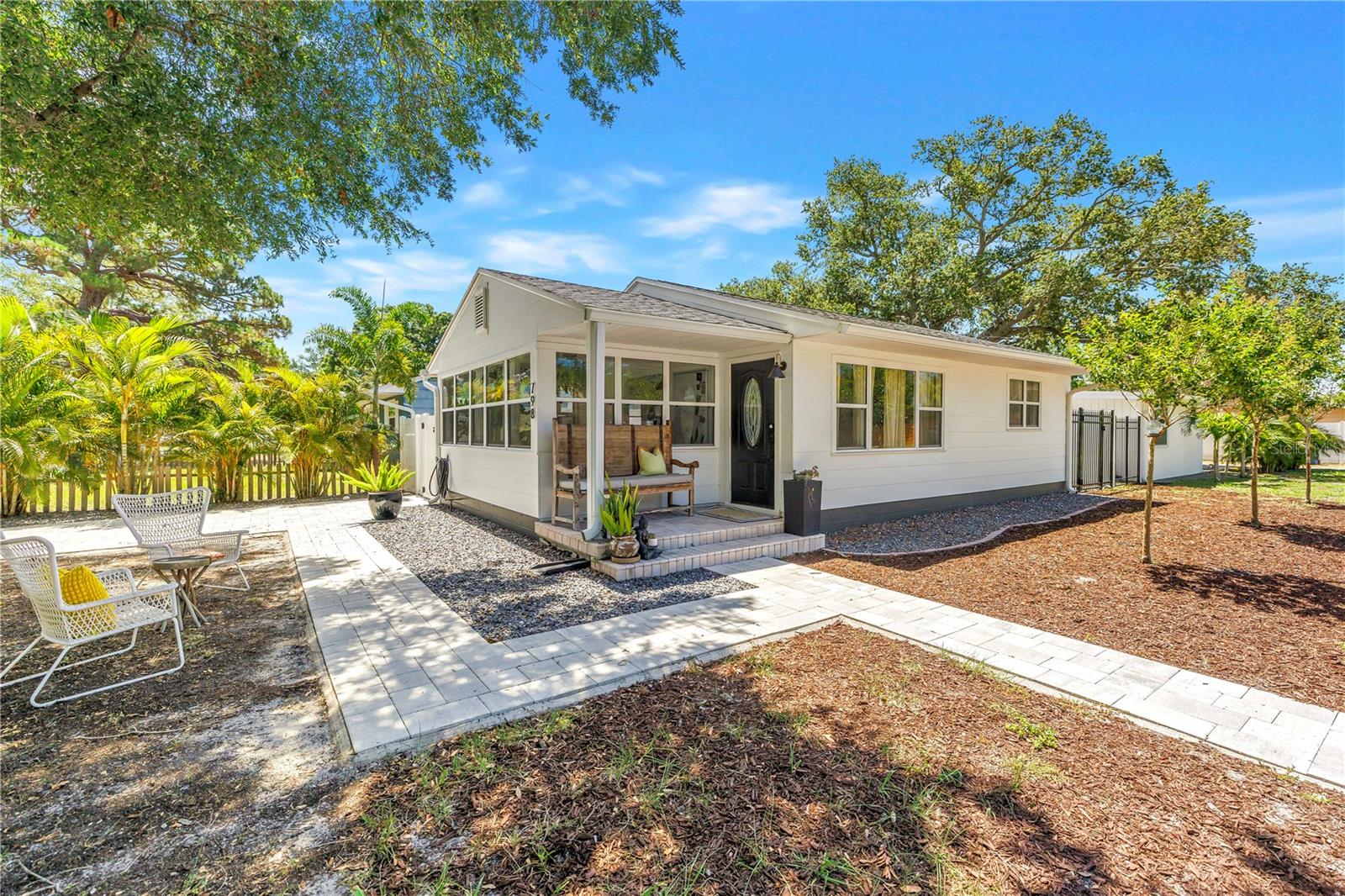 Welcome to 798 & 798 1/2 45th Avenue North, nestled in one of St. Petersburg's most desirable and Rapidly growing neighborhoods. Perched on an Expansive corner lot and surrounded by Million-dollar homes, this Meticulously Maintained property blends Historic Charm, Modern updates, and Exceptional Income-producing potential. The main residence offers 2 bedrooms and 1 bathroom, complemented by a generously sized, Sun-drenched glass-enclosed Sunroom that functions as an additional living area while seamlessly connecting to the outdoors. Upon entry, you'll find an Open concept floor plan featuring wood flooring throughout, classic cove ceilings and timeless character. Recent improvements include a Roof (2023), Hot water heater (2023), Stainless-steel appliances (2026), 220-volt outlet for EV charging (2025) and main driveway (2023). Step outside to an oversized deck perfect for barbeques, furry friends and gathering with family. A true standout feature is the private, fully permitted 578-square-foot ADU (Accessory Dwelling Unit), completed in 2023 and approved by the City of St. Petersburg. With its own private entrance and separate address (798 1/2 45th Avenue North), this versatile space offers exceptional flexibility for rental income, Multigenerational living, a Guest Retreat, Yoga/Gym or a private home office. Offered fully furnished, this beautifully designed modern 1-bedroom, 1-bath cottage is currently a successful Short term rental and presents endless possibilities as a private guest retreat, home office, multigenerational living space or income-producing rental property. The cottage features Soaring Vaulted Ceilings, Exposed beams, Dual Mini-split HVAC systems, Full Kitchen and a Spacious Bedroom with an ensuite bathroom featuring a enclosed Glass walk-in shower. Step outside to perfect outdoor space where guests can enjoy morning coffee or relax beneath the mature oak tree. Ideally located and walking distance to the new Whole Foods, Shopping, Restaurants and just a short bike ride to Crescent Lake and vibrant Downtown St. Pete!! Whether you're seeking a Primary residence, an Investment opportunity or the perfect combination of both, this exceptional Allendale Oaks property delivers. Offering the perfect blend of charm, versatility, location and peace of mind in a non-flood zone, this is a true gem. Schedule your private showing today!