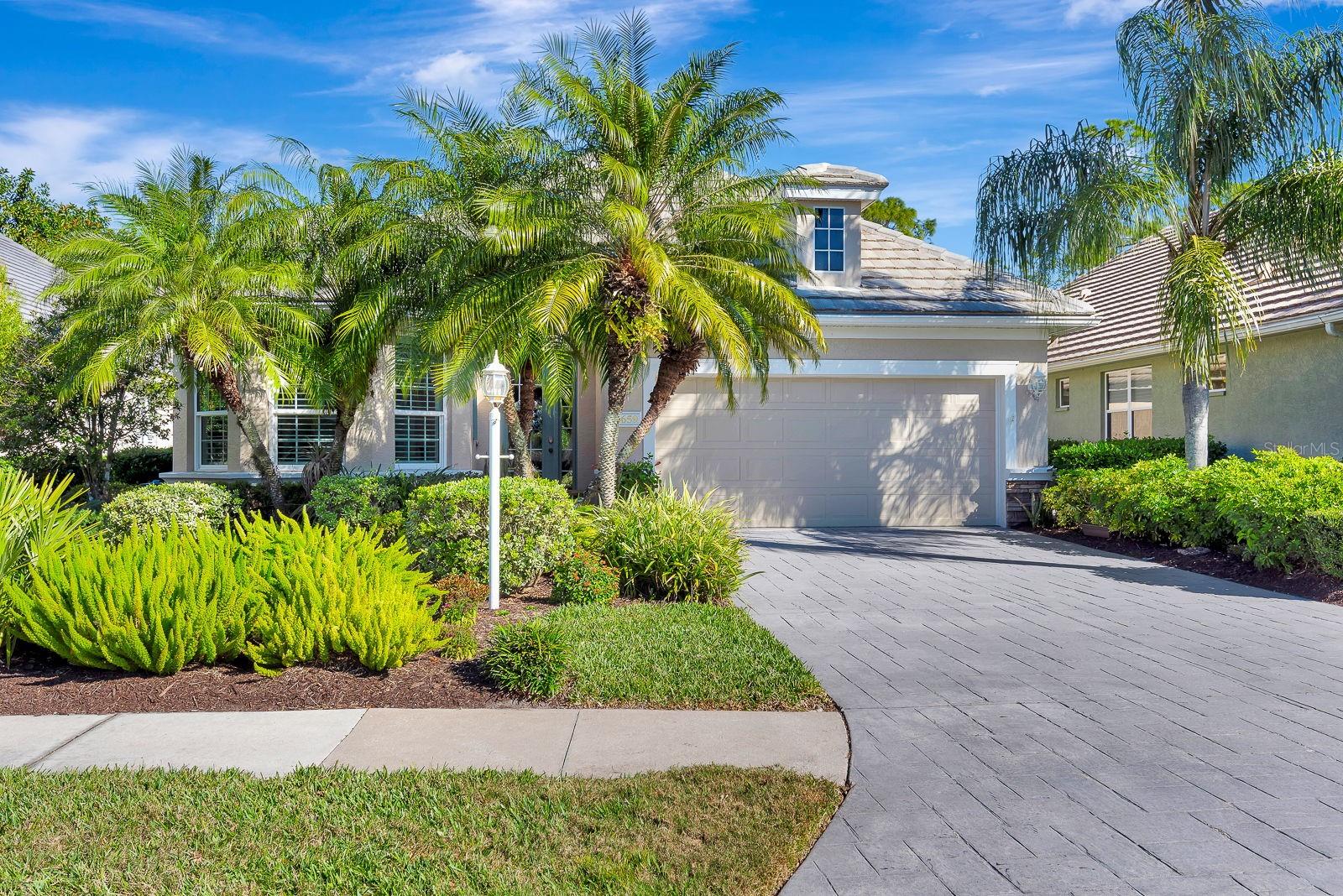 This lovely two bedroom, two bathroom home is beautiful inside and out, and has all the upgrades you're looking for! A brand NEW ROOF and gutters (2026), new AC/HEAT (2023), a 22kW whole-house Generac GENERATOR (2020), and PGT WinGuard hurricane impact WINDOWS (2019). Additionally, it boasts these upgrades: overhead garage storage racks (2025), water heater (2024), lanai screens (2024), water softener (2022), epoxy garage floor (2021), plantation shutters and roller shades (2020), and GE Profile appliances (2019). Inside, the open floor plan with towering 12' ceilings is ideal for relaxing and entertaining. The eat-in kitchen offers ample space to prepare and enjoy your meals. A separate area for formal dining (or whatever you'd like to use it for) lies adjacent to the kitchen and living room. Your bedroom looks out at the peaceful preserve behind the house and has its own door to the screened, very private lanai. There are no neighbors out back, other than the deer that pass by most mornings! And family members or guests will appreciate their own private suite and bathroom at the front of the house. Between the two bedrooms is a flex room that you can set up as an office, den, craft room, another guest room, or anything you'd like! As you drive and walk the neighborhood and community, you'll be struck by the beauty of tall, mature palms and oaks, tranquil ponds, golf fairways and greens, and wide walking paths. The heated neighborhood pool and spa are just steps away! And you'll be happy to know this home is in a maintenance-free neighborhood! The "Lakewood Ranch Golf and Country Club," which meanders through the community, has four 18-hole courses and multiple facilities, including a banquet hall and restaurants, a fitness center with a pool, and tennis and pickleball courts. Membership is optional. Of course, you'll be extremely happy with this home's location. Lakewood Ranch Main Street and Waterside - gathering spots with a plethora of boutiques & restaurants - are just 5 minutes away. UTC (University Town Center), a shopper's heaven, is 10 minutes away. From a travel standpoint, you're a mere 10 minutes from I-75, and only 20 minutes from SRQ (Sarasota Bradenton International Airport), served by all major domestic airlines, and an hour from TPA (Tampa International Airport) for those trips abroad. Downtown Sarasota, St Armand's Circle, and pristine Gulf beaches are no more than 30 minutes away! This is truly an outstanding home in an awesome location! If you live in the area or have visited, you already know the beauty and wonders of Florida's Gulf coast, and the Sarasota/Bradenton area in particular. It's a fantastic place to live, or just spend the winters!  An exceptional array of restaurants, live music, theatre and dance venues, art galleries, shopping, sports, beaches, and houses of worship awaits you. So come see this perfect snowbird escape or year-round residence in the "Spyglass" neighborhood of "The Country Club", the most beautiful community in Lakewood Ranch!