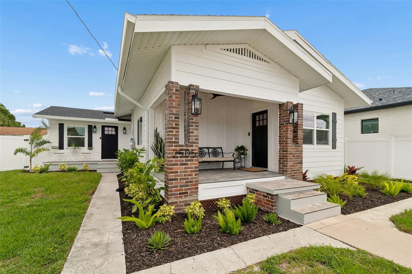 Originally built in 1924, this exceptional South Tampa property has undergone a comprehensive, contractor-led restoration with permits filed and closed through the City, transforming it into a virtually new home while preserving its timeless character. Unlike many renovations that focus only on cosmetic updates, this property received extensive improvements behind the walls and throughout every major system. Nearly every component of the property has been replaced or upgraded, including a new roof, impact-rated windows, Hardie Board siding, HVAC systems and ductwork, water heaters, electrical wiring and panels, plumbing, insulation, all drywall and insulation, flooring, kitchens, bathrooms, appliances, lighting, and more. Structural foundation improvements have been completed, a firewall has been added between units, and any compromised framing discovered during construction was replaced. The result is a turnkey, low-maintenance asset that offers the charm of a historic South Tampa home with the reliability and efficiency of modern construction. 

The duplex is thoughtfully configured as a 2bd/2ba and 2ba/1ba; with separate electric and water meters, private fenced backyards for each unit, individual mailboxes/addresses, separate 2-car driveways, each with their own W/D, and RM-16 multifamily zoning, creating flexibility for investors, owner-occupants, or multigenerational living. Located in Armory Gardens, one of South Tampa's fastest-growing neighborhoods, residents enjoy a walkable lifestyle just minutes from Villa Brothers Park, the JCC, Midtown Tampa, Downtown Tampa, the Riverwalk, Tampa General Hospital, MacDill Air Force Base, and some of the area's most popular local restaurants and entertainment destinations. Even more impressive, the property is zoned for Mitchell Elementary, Wilson Middle School, and Plant High School—one of Tampa's most sought-after public school districts. Opportunities to purchase a fully permitted, extensively rebuilt duplex in the Plant district are exceptionally rare. Whether you're looking to for multi-generational living, generate income or add a premier asset to your portfolio, this property delivers a level of quality and peace of mind that is difficult to replicate at any price.