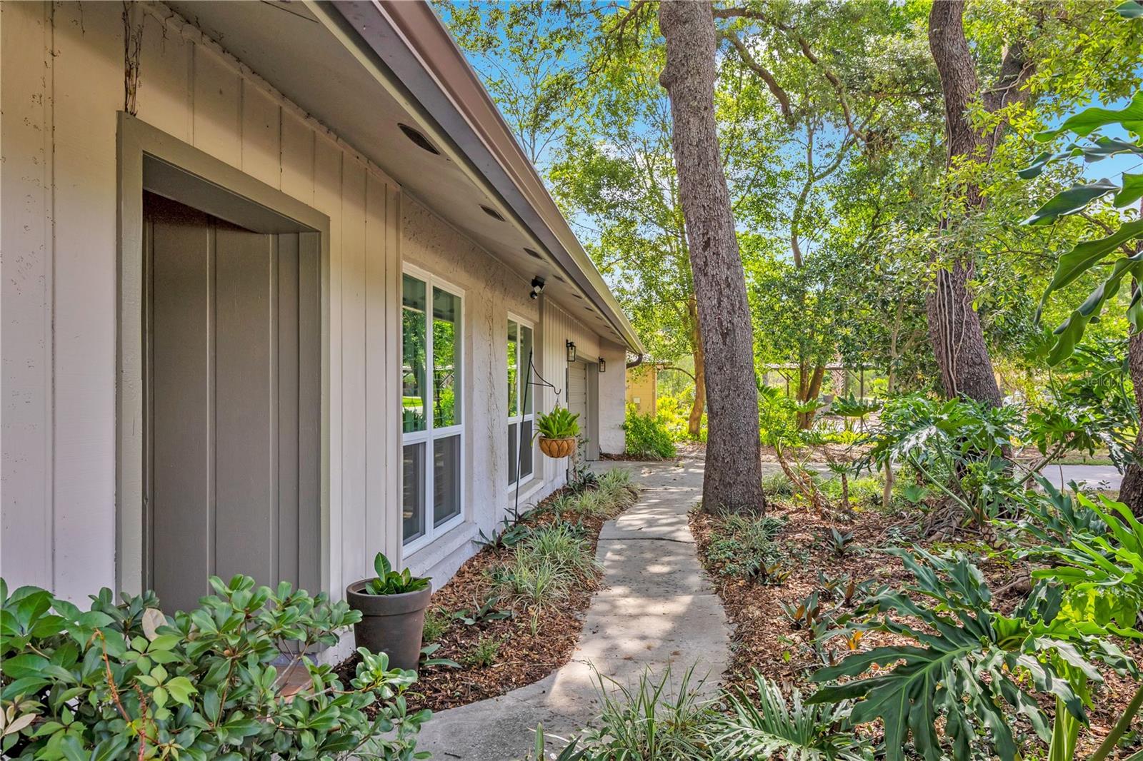 Completely remodeled and move-in ready, this stunning 3-bedroom, 2-bath pool home combines custom design, modern upgrades, and an unbeatable Altamonte Springs location. Situated on a spacious lot with no HOA, this home offers the perfect blend of character and convenience. The showpiece of the home is the spectacular custom kitchen renovation. Designed for both entertaining and everyday living, the kitchen features quartz countertops, ceiling-height cabinetry, a farmhouse sink, stainless steel appliances, open shelving, a large center peninsula island, and a stunning decorative pressed-tin ceiling that creates a truly one-of-a-kind space. The open-concept design flows seamlessly into the family room, where a beautiful stone fireplace creates a warm and inviting gathering space.

The primary suite offers a spa-inspired bathroom renovation completed, featuring a custom-built furniture-style vanity, oversized walk-in shower with frameless glass enclosure, floor-to-ceiling subway tile, rain shower head, and designer finishes throughout.

Additional improvements include a roof replaced in 2018, windows replaced throughout the home in August 2024, a new front door and exterior garage access door, a new patio door, and a new vinyl fence installed in May 2025.   Step outside to your private backyard retreat featuring a sparkling pool, screened outdoor living space, and plenty of room to enjoy Florida's year-round sunshine.
Located just minutes from Cranes Roost Park, Uptown Altamonte, Altamonte Mall, AdventHealth Altamonte Springs, top-rated dining, shopping, and entertainment, this home offers exceptional convenience with quick access to I-4, Downtown Orlando, Winter Park, Maitland, and Lake Mary.  If you've been searching for a fully renovated pool home in Altamonte Springs with no HOA, a custom designer kitchen, luxury primary bath, and major system updates, this home is a must-see.