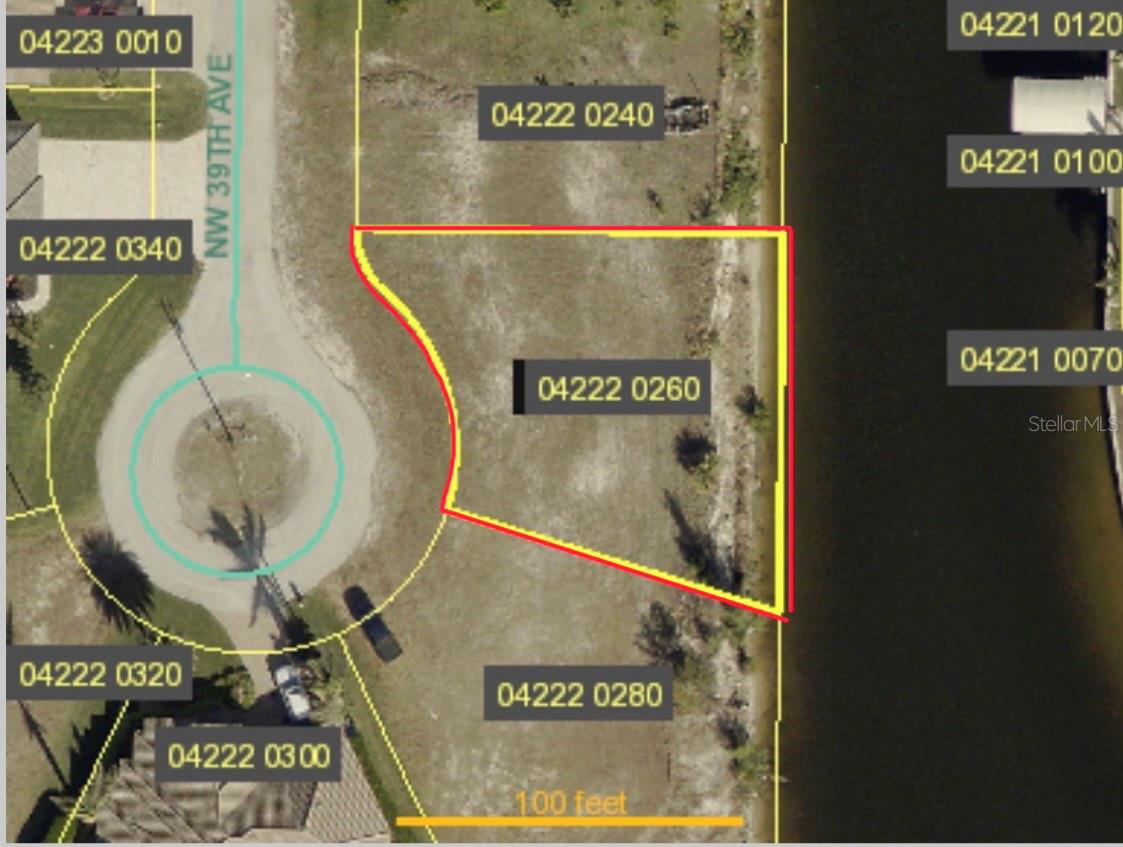 Discover this exceptional 10,000 sq ft waterfront lot, perfectly positioned in a highly desirable neighborhood surrounded by beautiful newer homes. With serene water views and a peaceful setting, this property offers the ideal canvas to build your custom dream home.

Enjoy convenient access to The Shops at Midpoint Center, featuring a variety of retail stores, dining options, and everyday essentials. Nearby coastal attractions include Four Freedoms Beach and Yacht Club Public Beach, perfect for relaxing by the water or enjoying sunsets.

Outdoor enthusiasts will appreciate access to the Matlacha Pass Aquatic Preserve, ideal for kayaking, paddleboarding, and exploring Florida’s natural beauty. Boating is made easy with Burnt Store Boat Ramp nearby.

For recreation and entertainment, Tropical Breeze Fun Park offers mini golf, laser tag, and family-friendly activities, while Seahawk Park provides a unique space for RC aircraft enthusiasts.

This prime lot offers ample space for a custom home, pool, outdoor living area, and private dock. With its waterfront location, you can enjoy boating, jet skiing, fishing, and breathtaking views right from your backyard. Whether you’re looking to invest or create your own slice of paradise, this property presents an outstanding opportunity to experience the best of the Florida lifestyle.