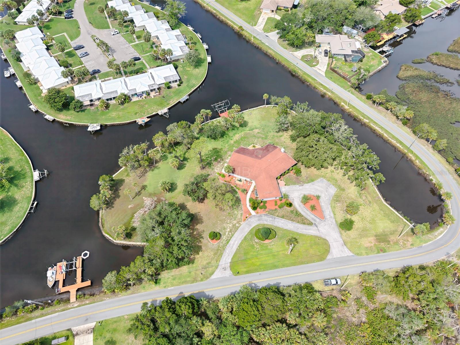 CRYSTAL RIVER | 628 FEET OF WATERFRONT | 1.53 ACRES | GULF ACCESS | ISLAND-LIKE SETTING
There are waterfront homes. And then there is this!

Experience this property before you ever leave your home. Our immersive 360° Virtual Tour lets you walk every room, step onto the waterfront, and feel the island lifestyle for yourself — day or night, on any device. Click the tour link in this listing and see why buyers who visit never want to leave.

Wrapped by water on three sides, this remarkable 1.53-acre Crystal River estate delivers something almost impossible to find — the feeling of living on a private island without ever leaving the mainland. Seven hundred feet of pristine waterfront with direct access to the Crystal River and the Gulf of America frames a property so rare, it simply does not come up twice in a lifetime.

The mid-century home has been thoughtfully and completely renovated, marrying the soul of old Florida with the standards of a luxury residence. Travertine marble floors run throughout the entire home. Hardwood interior doors. A wood-burning fireplace anchors the living space with warmth and character — the kind of feature that turns a house into a home. Dual-zoned Trane HVAC systems replaced in 2022 and 2024. A 2012 roof. Brand-new 2025 GE appliances. 2025 washer and dryer. Every system has been addressed — this is not a "mostly updated" property. This is done right.

Outside, mature oaks and palms frame the landscape while dolphins, sandhill cranes, and manatees make frequent appearances along your waterfront. The 10,000 lb. boat lift — with Kevlar-wrapped pilings completed in 2026 — is ready for your vessel the day you close. The Gulf is not a drive away. It is in your backyard.

For investors, the numbers speak for themselves: the current owner operated this property as a successful VRBO for three years at $350 per night. The income potential is proven and waiting for a new owner to step in.

Two details that will matter enormously when you run the numbers: flood insurance is transferable at only $2,000 annually — a figure that is nearly impossible to replicate on new policies — and the seller will consider financing. In today's market, that combination is as rare as the property itself.

Crystal River is one of Florida's last truly unspoiled coastal communities — home to manatees, world-class fishing, and a waterfront lifestyle that buyers from across the country are actively seeking out. Properties like this one don't just sell. They are claimed.
Schedule your private showing before someone else does.