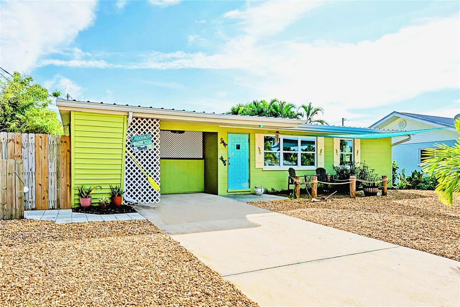 Virtually Staged. Reduced, ACT FAST! Three-bedroom Anna Maria Island beach home, 300 steps to the island's world class beaches! This Holmes Beach retreat, located on Anna Maria Island, is ready and waiting for you! Discover this fully updated, bright and airy split plan, three-bedroom home spanning over 1,100 square feet, thoughtfully designed with open living space combining the kitchen and living room areas. Located on a quiet cul-de-sac, this home sits right in the Island’s sweet spot between the Cortez and Manatee Bridges, providing easy access on and off the island. You’re just a short walk or golf cart ride away from white sandy beaches, restaurants, shops, and a convenient free trolley stop. You will see all properties were not created equal as you step into your own tropical, completely private backyard oasis complete with screened in lanai, wet bar and highly sought after southern exposure. Bask in the sun, don't sit in the cold shadows with a subpar exposure. Enjoy a beautiful, heated saltwater pool equipped with sprayers, fountains, and a sun platform for ultimate relaxation. A multilevel waterfall pond adds to the tranquil atmosphere, featuring a charming bridge that leads you over the pond directly to the gorgeous pool area. The expansive 9,000-square-foot lot is enhanced by landscaping stones, providing ease of maintenance. The home features a metal roof and impact windows for peace of mind. It boasts 2025 appliances, including a washer and dryer, along with all-new cabinetry and quartz countertops in both the kitchen and master bath. Fresh paint and 5-inch base molding through-out complete the modern look and feel. This property is offered turnkey furnished and is rental ready for monthly stays. RV and boat parking allowed! There is nothing to do here but relax and enjoy your surroundings: take a dip in the pool, stroll to the beach, indulge in the varied dining options this island has to offer, from tiki bars to fine dining. Enjoy the manatees and dolphins playing in the canal across the street and parrots flying overhead! Immerse yourself in all the serenity and joys this beautiful island has to offer. Whether you’re seeking relaxation or adventure, this home provides the perfect base for enjoying Anna Maria Island’s unique charm and vibrant lifestyle. All NEW in 2025, Washer, Dryer, Refrigerator, Range, Dishwasher, Microwave, High Velocity Range Hood, Pool Heater, Pool Pump, Water Heater, Kitchen Cabinets and Quartz Countertops, Master Bath Cabinets and Quartz Countertop, Guest Bathroom with New Vanity and Top, All Furniture and Bedding. Impact Windows installed 2021 and 2022, Metal Roof installed 2018. Possible owner financing.