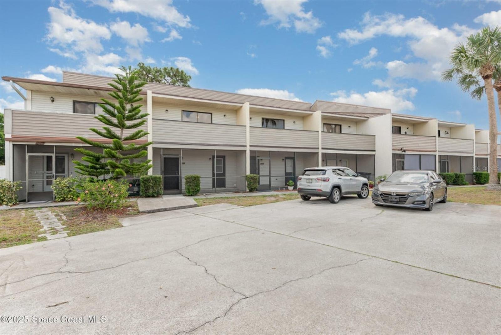 This cute condo is located in central Titusville close to major roadways, shopping, medical facilities and restaurants. Kitchen has new stainless steel electric range, refrigerator and built in microwave. Newer upper cabinets over breakfast bar. Living room dining room combo leads to back screened porch, great for entertaining. Carpeting replaced throughout last year and both porches have been re-screened. Entire interior has been painted a year ago. A/C recently replaced. Lots of storage to include under the stairs closet and upstairs has wall to wall closet in hallway for extra storage. Both bedrooms features their own private full bathrooms and balconies. All bathroom commodes are new. Downstairs also features a half bath, screened porches, front and back of the unit and even a small back yard. Both balconies have been replaced with new pressure treated wood. Water heater replaced in 2017. Inside laundry room has washer dryer hook up.