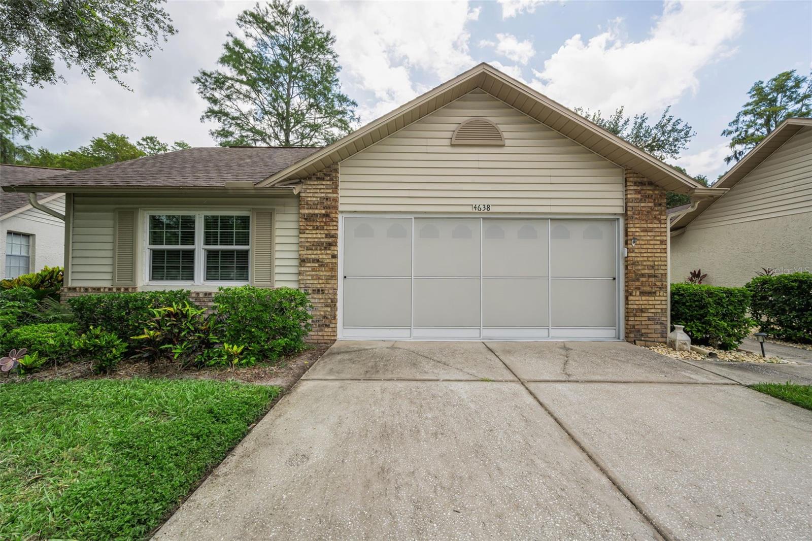 Call to schedule your private showing of this beautifully maintained stand-alone 2-bedroom, 2-bath villa in one of the area's most desirable 55+ communities. Enjoy the privacy you've been looking for with no rear neighbors and a peaceful nature preserve as your backyard. The covered and screened patio is the perfect place to start your morning with a cup of coffee or unwind in the evening while enjoying the tranquil surroundings and Florida's beautiful weather. Inside, you'll find a bright, clean home designed for comfortable living. Tile flooring throughout makes maintenance easy, while ceiling fans in most rooms help keep the home cool year-round. The spacious primary suite easily accommodates a king-size bedroom set and features an oversized walk-in shower, dual sinks, and an exceptionally large walk-in closet. The split-bedroom floor plan provides privacy for overnight guests or visiting family. Life here is about more than just the home—it's about the lifestyle. This vibrant 55+ community offers an impressive selection of amenities, including a sparkling swimming pool, golf course, tennis courts, clubhouse, library, recreation room, and a full calendar of social activities where it's easy to meet neighbors and make lasting friendships. Conveniently located near Little Road and State Road 54, you'll enjoy easy access to shopping, restaurants, medical facilities, and all the everyday conveniences you need. If you're looking for privacy, low-maintenance living, and an active Florida lifestyle, this villa is the perfect place to call home. Lawn care taken care of by the owner Call today to schedule your private tour.