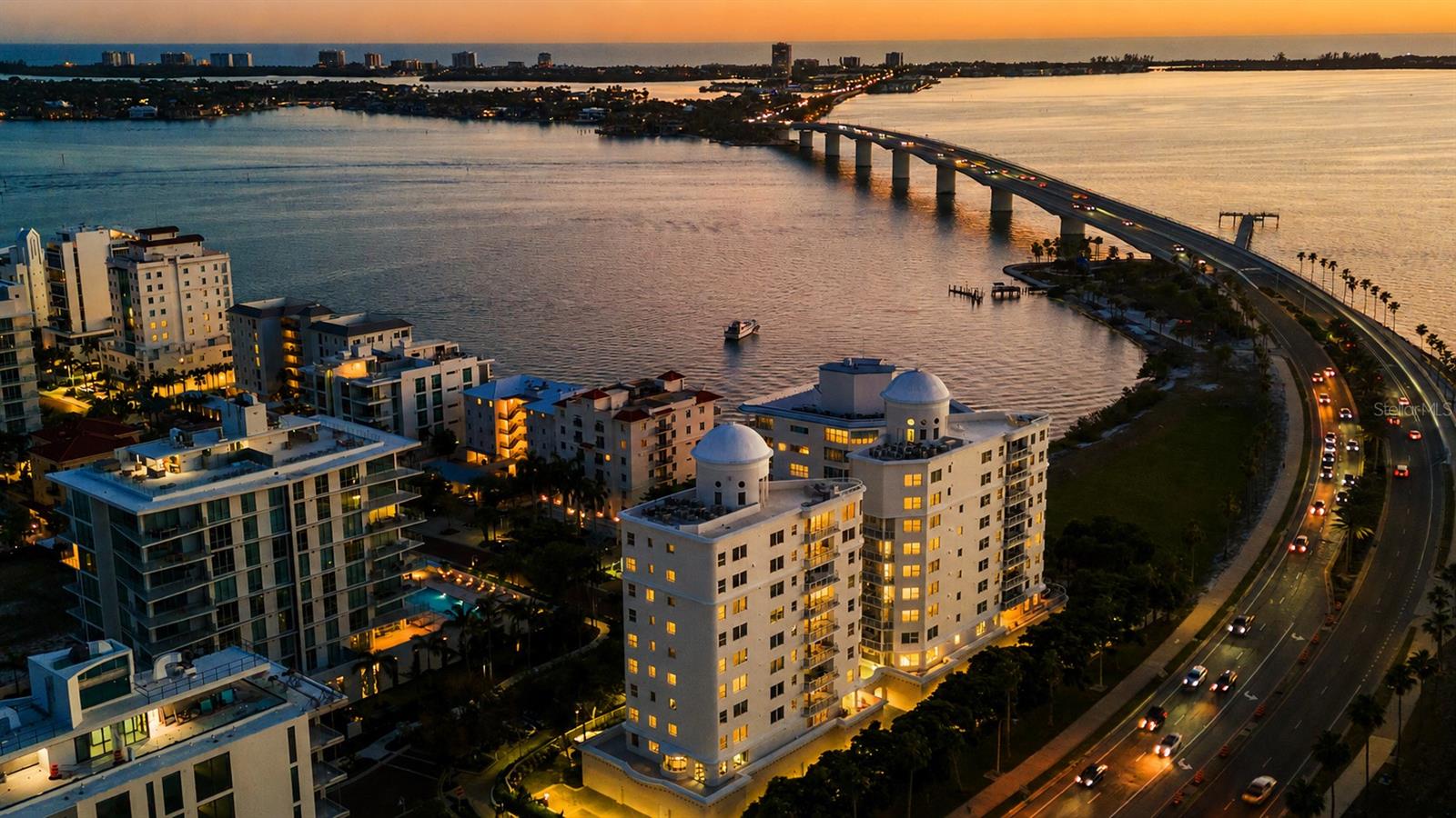 Experience elevated coastal luxury at Vista Bay Point, ideally on prestigious Golden Gate Point in the heart of downtown Sarasota. This exceptional, one-of-a-kind second-floor residence delivers a rare combination of privacy, sophistication and effortless access, with a private elevator opening directly into your own foyer and an oversized two-car garage with additional storage on the level below, along with a private staircase that connects directly to the residence. In addition to all this, there is direct access to a private wraparound terrace, the only residence in the building with an outdoor area of this size, and up to two dogs are welcome, allowing them plenty of room to roam. From the moment you enter, the home is bathed in natural light, with expansive impact glass windows throughout framing serene bay views, shimmering city lights and Sarasota’s iconic sunsets. The open, flowing design is elegant and inviting, enhanced by refined finishes and custom details that create a sense of arrival, while a Sonos sound system and Crestron lighting system add to the thoughtful touches that make this home exceptional. Taking center stage, the gourmet kitchen is designed to impress, featuring custom cabinetry, rich stone surfaces, a generous island with seating for up to six, and premium appliances including Sub-Zero refrigeration and a professional Thermador 48-inch gas range with grill, griddle and dual ovens, all seamlessly connected to the dining and living spaces to create an effortless indoor outdoor lifestyle. The terrace provides a setting for morning coffee, evening cocktails or dining, offering multiple seating areas along with beautiful bay views. The owner’s suite offers a peaceful retreat with a spacious walk-in closet and a beautifully appointed bath designed for relaxation, while two separate guest suites with full baths ensure comfort and privacy for visiting family and friends. Vista Bay Point is an exclusive, gated boutique community offering a full suite of luxury amenities, including a heated pool and spa, sundeck with grilling area, fitness center with premium equipment, theater room, elegant owners lounge with pool table and bar, and a private guest suite for extended stays. This residence places you just moments from Sarasota’s vibrant downtown, the marina, world-class dining, Ringling Bridge, cultural attractions, St. Armands Circle and the region’s award-winning beaches, making this more than a residence, it is a lifestyle defined by privacy, prestige and the best of Sarasota waterfront living. Ask for the complete property catalog with all the information about this residence.