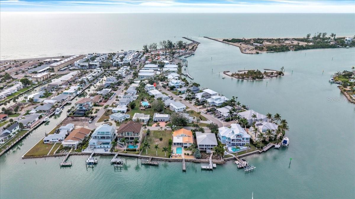 Location! Location! Location! Welcome to 904 Inlet Circle, located in the quiet Tarpon Center Bahama Villas community on Venice Island with private BEACH ACCESS. This 15-home neighborhood offers an ideal location just two blocks from the beach, one block from the Venice Jetty, and Crow’s Nest Restaurant, and close to the Venice Yacht Club. Enjoy easy access to morning sunrises, evening sunsets, and the relaxed coastal lifestyle that the Venice area is known for. This home features over 1,700 sq. ft. of living space with 3 bedrooms and 2 bathrooms. Nearly every part of the home has been updated. Recent improvements include a new roof (2022), impact windows and doors (2023), new AC and hot water heater (2024), new flooring throughout (2024), and fresh interior and exterior paint. The kitchen has been completely remodeled with solid wood cabinets, granite countertops, and a farm sink. Both bathrooms have also been updated. Plumbing and electrical updates have been completed, providing added peace of mind. A spacious and private lanai with new pavers offers a comfortable outdoor living area. Bahama Villas has been a well-maintained community for nearly 60 years and continues to be one of the most desirable neighborhoods on the island. The low quarterly HOA fee of $500 includes lawn care and access to one of the largest heated community pools on Venice Island. Located just minutes from Downtown Venice, residents can enjoy local shopping, dining, theater, and parks. This home offers a rare combination of updated living space and a highly sought-after island location. Schedule your own personal tour today!