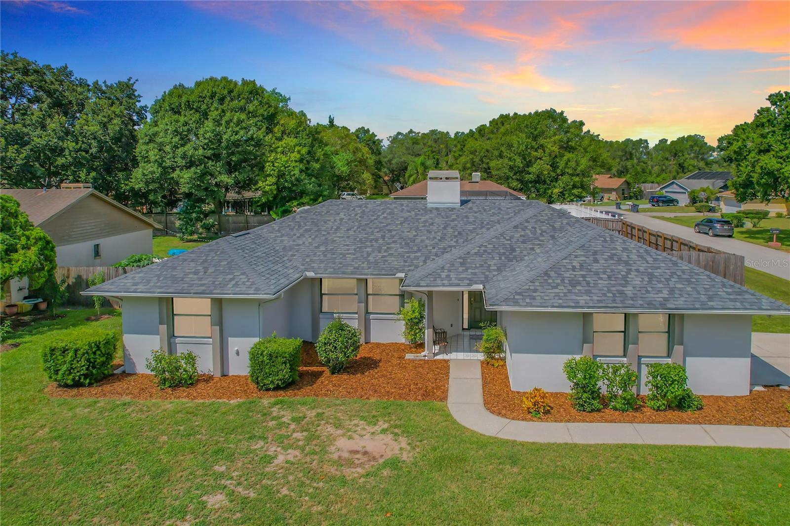 HARD TO FIND! Located in the Lake Gibson school district and on a large corner lot, this 4bed/2bath home is MOVE-IN READY! BRAND NEW INTERIOR & EXTERIOR PAINT, ROOF INSTALLED 8/2023, A/C SYSTEM- 9/2015. This split bedroom floorplan offers a spacious living room with a fireplace.  The kitchen has updated counters & backsplash and overlooks the dedicated dining area, plus there's a nicely sized breakfast bar. Exit the dining area by French Doors and you'll enjoy the window-filled Florida Room - overlooking the privacy fenced rear yard. The secondary bedrooms are generously sized!  The main areas of the home feature ceramic tile flooring and the bedrooms feature BRAND NEW CARPET. This home was originally built with a portion of the two-car garage being converted to a 4th bedroom and laundry closet. This 4th bedroom makes a great office, music or workout room.  With modifications, this area could be converted back to a two-car garage.  The garage door is still in place and functions and is currently a 12x10 storage area.   Located in a small, quaint neighborhood with a country feel, yet minutes to major shopping, golf & restaurants and Interstate 4 access.  Don't let this one get away!