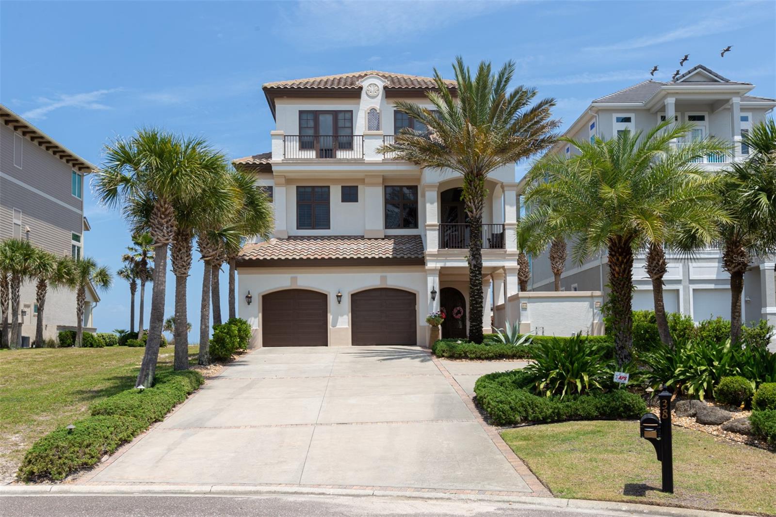 Experience the ultimate oceanfront living, where the sound of the waves and the scent of salt air greet you daily. This is a prime location with direct golf courses and oceanfront views. Boasting an open floor plan, this stunning 6-bedroom, 5.5-bathroom home offers sweeping ocean views and the 9th fairway from the great room, dining area, bar, and kitchen, all framed by walls of windows that bring the beauty of the sea indoors. A private beach walkway leads you to the sand, while a covered porch offers the perfect spot for shaded meals, and a sunbathing porch invites relaxation by your own beach. The spacious main-floor primary suite features a luxurious bath, expansive walk-in closet, and private laundry room. A richly paneled study/media room on the third floor opens to a balcony with breathtaking views of both the fairway and ocean. The exquisite outdoor living space includes a courtyard with a fireplace and direct access to the beach via your private walkover. In the kitchen, you'll find two dishwashers, a large propane cook's range with a double oven, two wine coolers, and a gas fireplace, making it perfect for both entertaining and cozy nights in. Additionally, the first-floor laundry room is spacious, featuring built-in upper and lower wall cabinetry on both sides, a built-in sink, and ample storage space to accommodate several guests.

This property is nestled in a maintained village, where landscaping and irrigation are thoughtfully included in the quarterly HOA fees. Say goodbye to lawncare worries, as everything is expertly handled for you. Embrace a carefree, low-maintenance lifestyle and savor the stunning outdoor spaces without the hassle. The house is equipped with an integrated audio system that controls lighting, Wi-Fi and music and also a security panel with an alarm system.

Membership to Hammock Beach is available to add to your beachfront living experience, allowing you to join the exclusive Hammock Beach Golf Resort & Spa. Enjoy world-class amenities, including the Jack Nicklaus-designed Ocean Course and the award-winning Conservatory Course by Tom Watson. The 91,000 sq. ft. Pool Complex features a water flume, lazy river, and eight delicious dining options with ocean views, including a signature restaurant. Indulge in the luxury spa, recognized as one of "The World's Top 50 Tennis Resorts" and a "2024 Silver Medal Tennis and Pickleball Resort" by Tennis Resorts Online. Enjoy eight lighted Hydro-Grid clay tennis courts, four brand-new regulation pickleball courts overlooking the Intracoastal Waterway, and a state-of-the-art fitness center with both cardio and weight training equipment.
