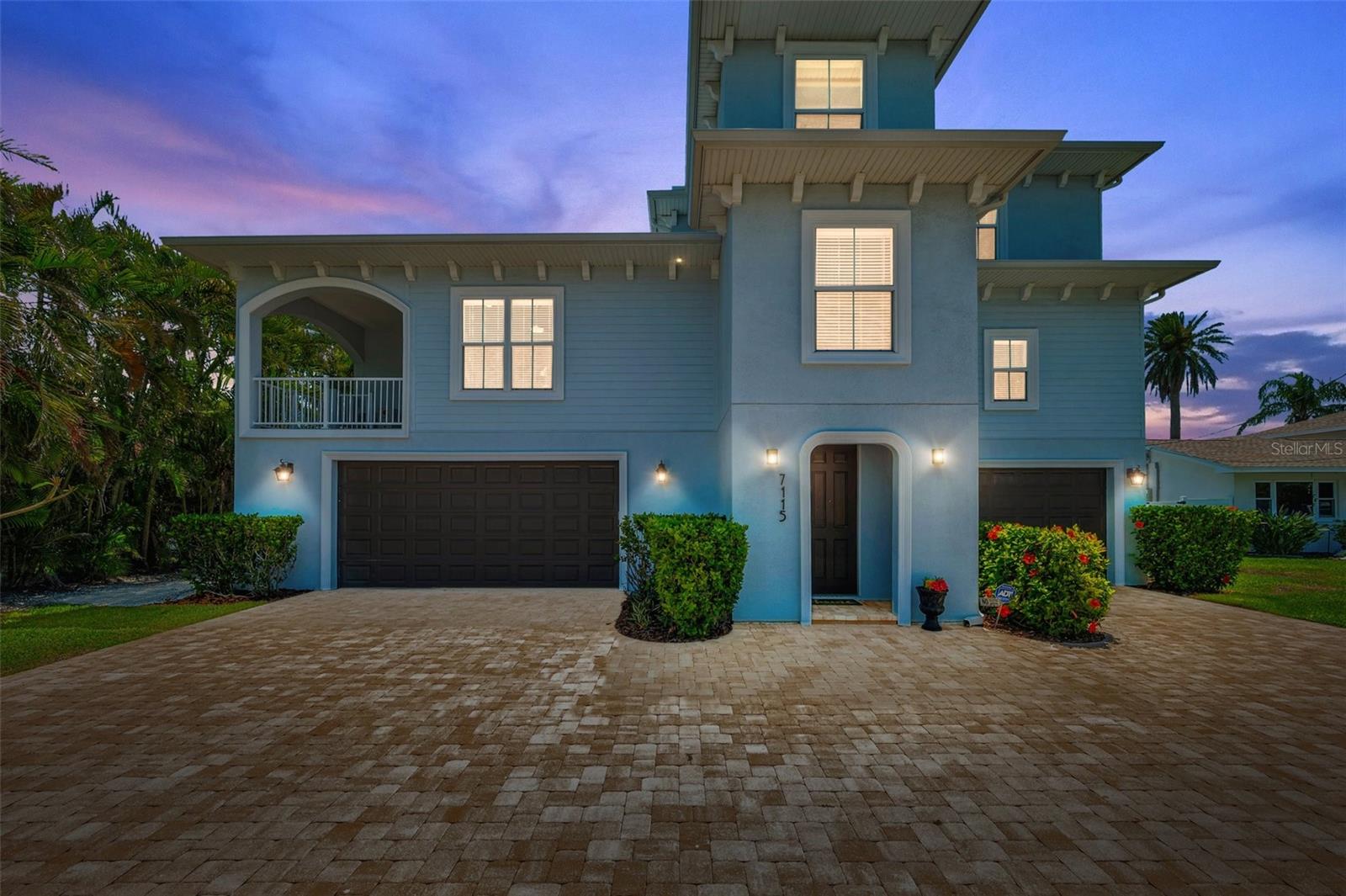 A rare waterfront estate on the wide-open intracoastal of Boca Ciega Bay—designed for those who value exceptional quality, space, privacy, and effortless Gulf access without compromise. Completed in December 2018, this luxurious, meticulously maintained 3-story home sits on an oversized 75-foot deep-water lot and delivers unobstructed water views. The morning sunrises are spectacular, and in the distance you can see downtown St Pete and Gulfport. Boaters will love the 72-foot Trex DOCK (water and electric ready), while beach lovers will enjoy the short walk to Upham Beach. The 2nd story main living level offers panoramic water views, over 500 square feet of covered balcony space, and an open layout that connects living, dining, and kitchen without interruption. A wood-burning FIREPLACE, WET BAR, and full wall of impact-rated sliding glass doors create a dreamy setting for entertaining or quiet evenings overlooking the bay. The kitchen is built for function and scale: solid wood custom cabinetry, DOUBLE OVENS, a 5-burner cooktop (2025), expansive island seating, and a fully outfitted walk-in pantry and laundry space. The primary suite is intentionally private and SOUND INSULATED—featuring water views, a freestanding jetted tub positioned at the window, dual marble vanities, an oversized shower with bench seat, and a custom walk-in chandeliered closet that exceeds expectations. Additional bedrooms, including a secondary suite, carry the same level of finish, spaciousness and elevated design. Outside, the luxury resort style living experience continues with a SALTWATER POOL, a covered lanai, and lush tropical landscaping providing privacy on either side of the nearly quarter acre lot. Performance and efficiency set this home apart: SOLAR panels (LOW ELECTRIC BILLS from $36/month), STEEL & insulated construction, ELEVATOR, whole-home WATER SYSTEM, GENERATOR switch, and an oversized 4-car garage with oversized doors, tons of extra storage and working space, and EV charging. FLOOD INSURANCE is assumable at just $620/year. From this location you can walk to many local shopping, dining. and entertainment options, including Corey Avenue with its famous Sunday Market and Horan Park's free concerts in the park. Schedule your showing today.