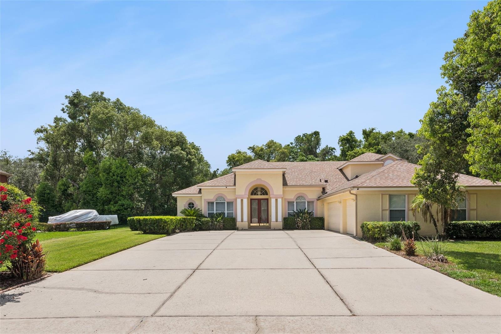 Welcome to Seville Chase, one of Winter Springs' premier gated communities. Situated on a private .41-acre lot, this custom-designed 5-bedroom, 4-bath home offers over 3,000 square feet of thoughtfully designed living space with a functional split floor plan that's perfect for both everyday living and entertaining.

From the moment you walk through the double front doors, you'll appreciate the natural light, soaring ceilings, crown molding, and timeless architectural details throughout. The spacious family room flows seamlessly into the kitchen, featuring a large island, abundant cabinet space, breakfast nook, and peaceful backyard views.

Step outside to the oversized covered lanai with a gas hookup for a future outdoor kitchen, overlooking a spacious backyard with plenty of room to build your dream pool.

The private primary suite offers dual walk-in closets, a spacious bathroom, and direct access to a flexible office or nursery. Three additional bedrooms are located on the main level, while upstairs you'll find a private guest suite with its own full bath plus a large climate-controlled bonus room—perfect for a home gym, media room, playroom, or extra storage.

This home has been meticulously maintained with numerous updates, including fresh exterior paint, updated lighting, painted garage floors, professionally cleaned HVAC ducts and carpets, plus an oversized driveway with plenty of parking.

Conveniently located near top-rated Seminole County schools, shopping, dining, golf, Winter Springs Town Center, UCF, Research Park, Siemens, and major highways including 417, 434, and I-4.

If you're looking for space, privacy, and a home you can truly make your own, this is one you won't want to miss. Schedule your private showing today.