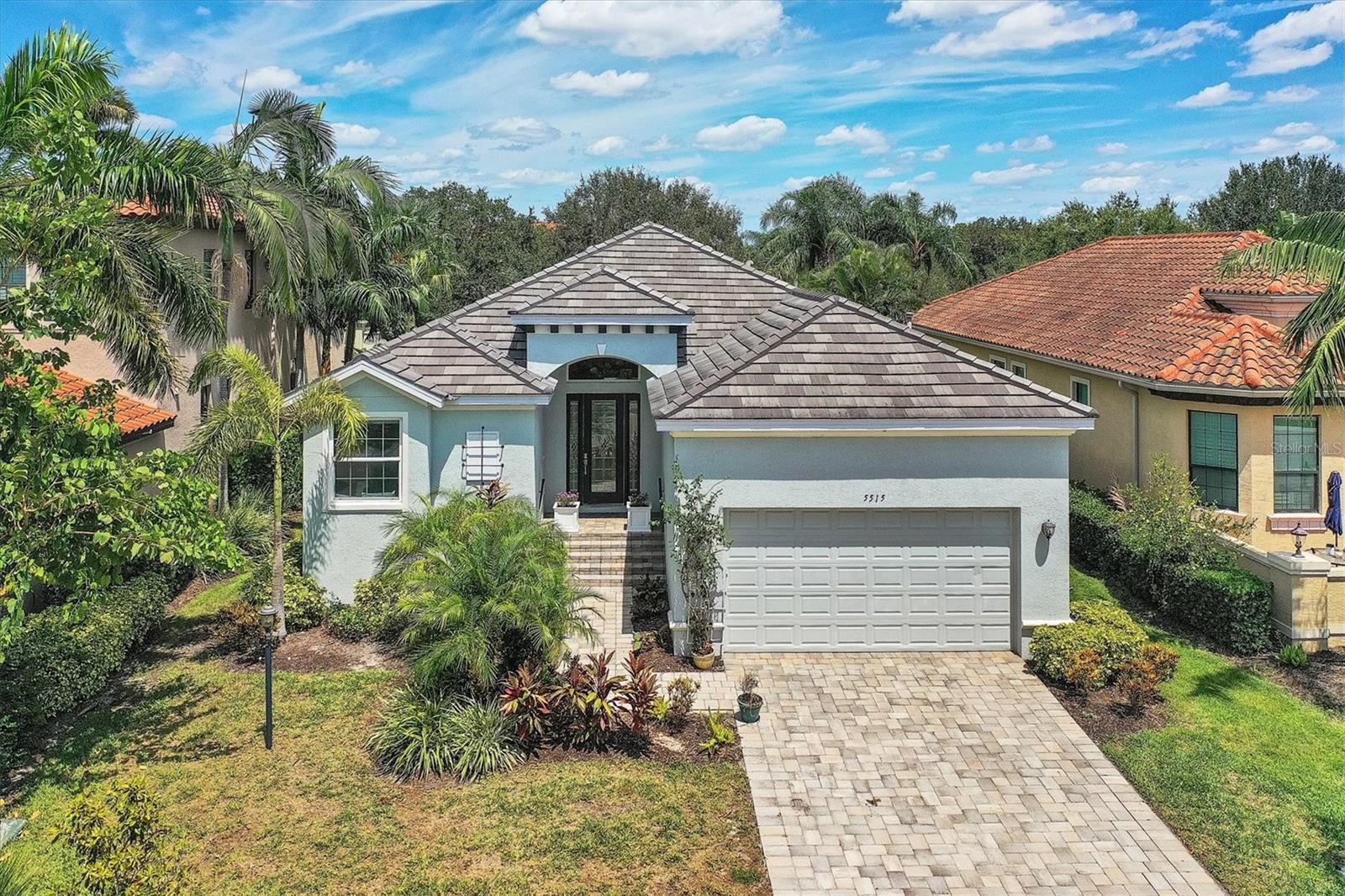 Priced to sell, 2018 built single story 3 bedroom, 2 bathroom Medallion Home with Impact glass doors & windows, Quart countertops, stainless steel appliances, farmhouse sink and large kitchen island, eat in space in kitchen, open floor plan, split bedrooms, 2 car garage with raised storage racks, tile backsplash and wood cabinets, walk in shower and walk in closet in Master bedroom, spacious screen porch in back, fenced backyard, security system, paver driveway/walkway/porches, and a reduced CDD ($1435) attached to annual property tax bill. HOA includes ground maint., clubhouse & COMMUNITY POOL, GATE, wifi/cable tv, observation pier. Legends Bay is a golf cart ride to IMG Golf Club and <<3miles from IMG Academy campus, short distance to shops and Bradenton beaches.