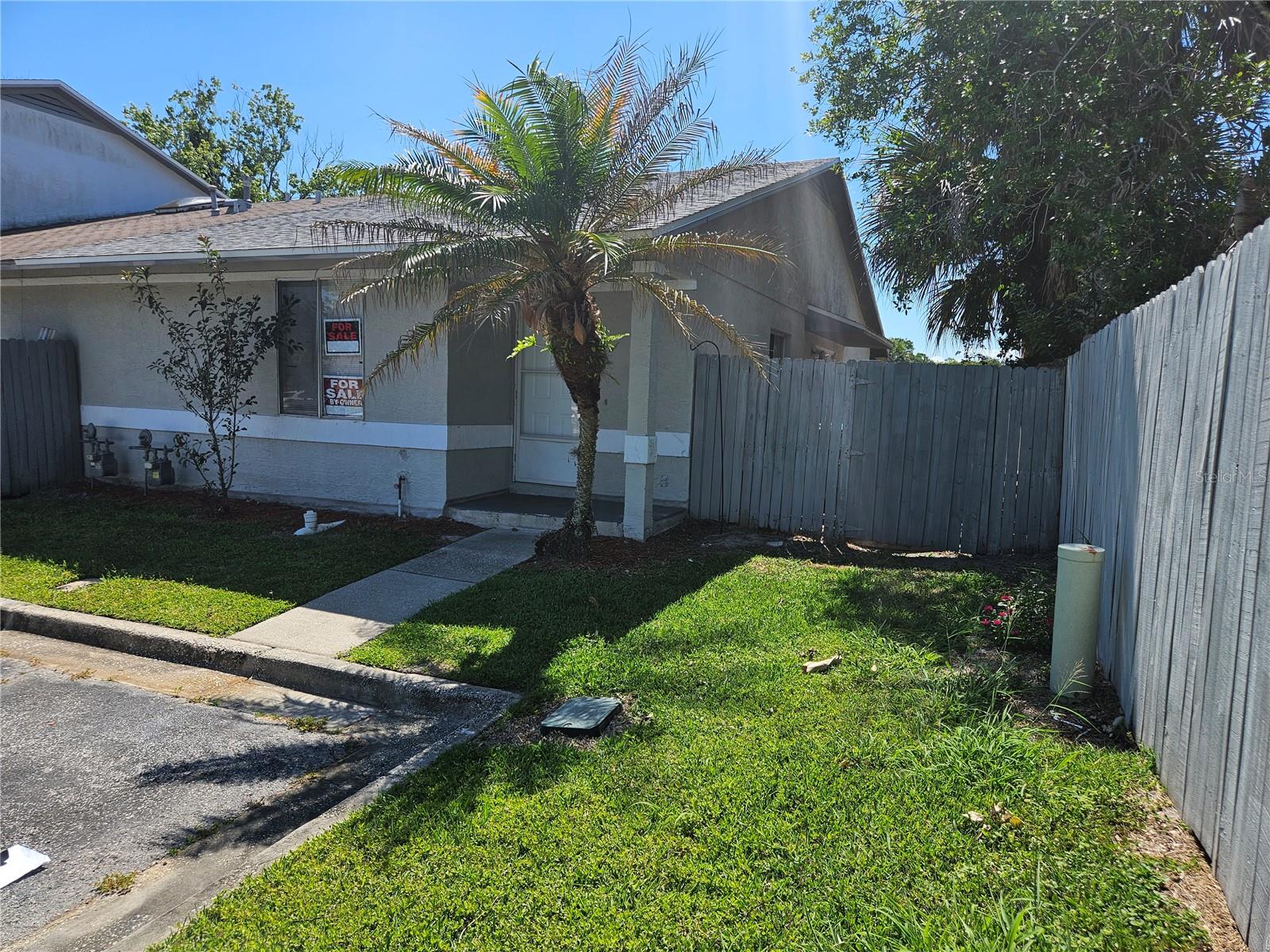 Here is your opportunity to own this affordable corner unit townhome. Charming 3 bedroom, 2 bathroom in Winter Garden with low HOA. Make this your home or add this to your rental investment portfolio. One level townhome with master bedroom with ensuite bathroom at the front of the unit. The two other bedrooms are located at rear of the unit. Bathroom was recently remodeled with floor to ceiling tile stand-up walk-in shower. New lower kitchen cabinets with beautiful countertop. Property is tile throughout. This town home is a corner unit, which gives you additional side yard space and a covered screen in lanai at the back of the unit. Community offers a large swimming pool and clubhouse. Located directly off Hwy 50, close to the Historic downtown Winter Garden and Winter Garden Village with lots of restaurants, boutiques, shopping, farmers market/activities. You also have access to major highways 429/turnpike,408. Schedule your showing today.