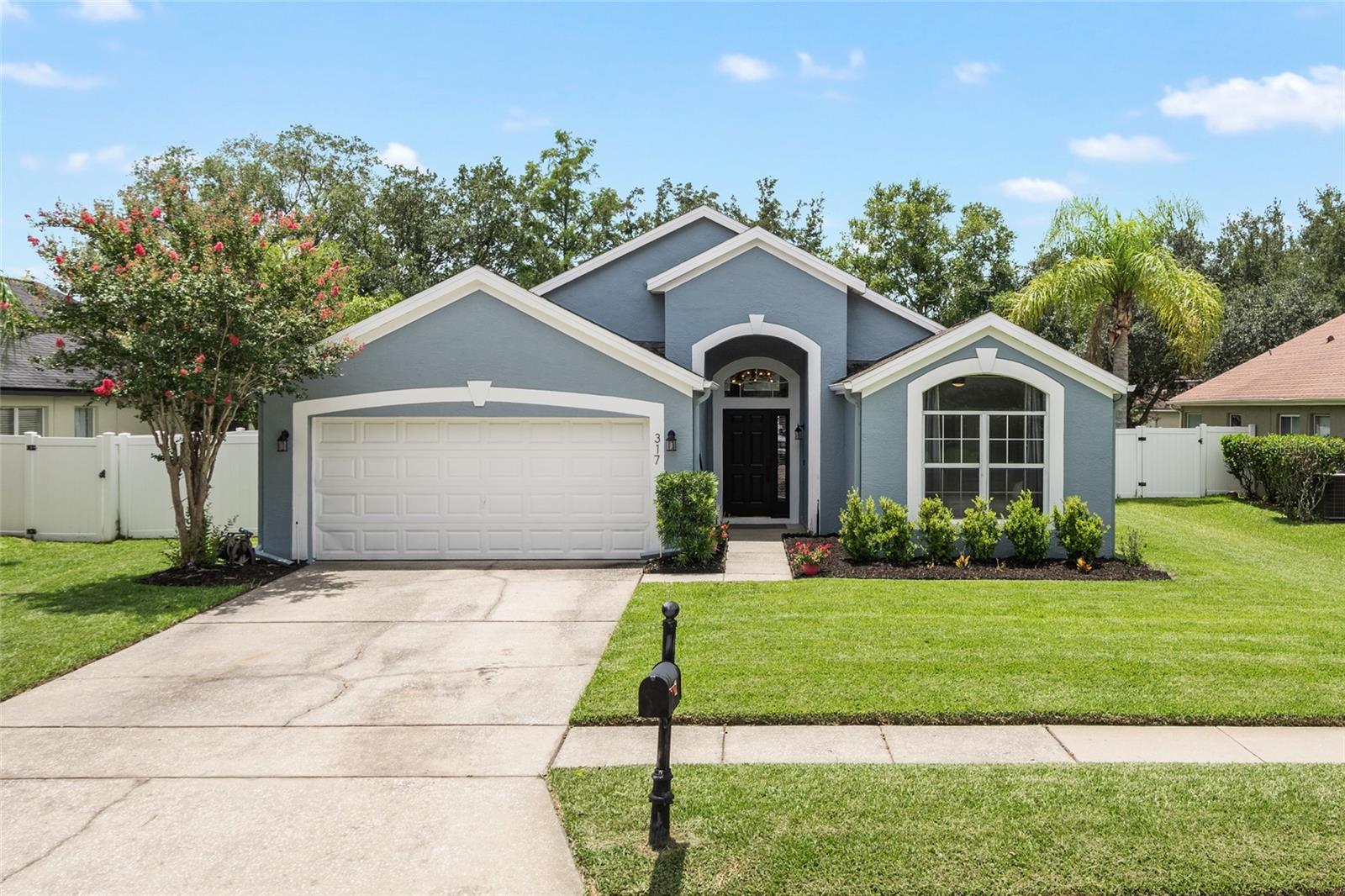 Welcome to this beautifully updated 3-bedroom, 2-bath home located in a desirable gated community. Featuring luxury vinyl plank flooring throughout, this move-in-ready home offers both style and comfort.
The updated kitchen showcases elegant quartz countertops and appliances that are approximately four years old. Designed with entertaining in mind, the kitchen opens seamlessly to the spacious great room and dining area, creating a bright, open-concept living space perfect for gatherings with family and friends.
The private primary suite features an oversized walk-in closet and a luxurious en-suite bath with dual vanities, a walk-in shower, and a separate soaking tub. Two additional spacious bedrooms are conveniently located on the opposite side of the home and share a well-appointed full bathroom.
Step outside to an oversized patio overlooking a beautiful, large backyard—an ideal setting for relaxing, outdoor dining, or enjoying Florida's year-round sunshine.
This exceptional home combines modern updates, thoughtful design, and a prime location in a sought-after gated community. Schedule your private showing today!