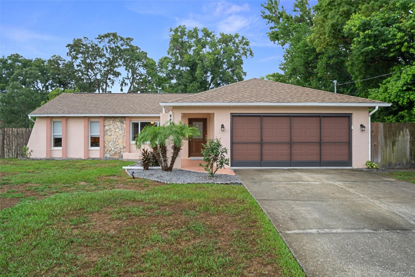 You have found your Fl. Dream Home !! This stunning 2-bedroom, 2-bath, 2-car garage home features an amazing heated pool and offers the perfect blend of luxury, comfort, and functionality. From the moment you arrive, you'll appreciate the thoughtful updates, stylish finishes, and exceptional attention to detail throughout. The open floor plan features a spacious great room that flows effortlessly into the stunning kitchen. Highlights include beautiful cabinetry, quartz countertops, a gorgeous tile backsplash, newer appliances and a convenient breakfast bar. The open and relaxing breakfast nook with a charming bay window is ideal for morning coffee, while the open living and dining areas make entertaining easy. Additional upgrades include designer interior and exterior paint, all new interior doors, a beautiful front entry door, newer windows, newer electrical panel 2021, new pool heater 2021, new pool pump and filter 2024, a brand new central heat and air system installed in 2024 (with transferable warranty) for year round comfort, new gutter screens installed in 2024, and a Brand New 30 year three dimensional shingle roof May 2026. Beautiful Ceramic tile flooring runs throughout the home, complemented by updated lighting and modern ceiling fans/lights. A generator hookup added in 2022 adds extra peace of mind. The spacious primary suite has beautiful laminate wood floors, modern ceiling fan/light and a large walk-in closet. The beautifully remodeled master bathroom has a step-in shower with glass shower doors, updated large vanity, and brand-new bathroom sinks installed in 2026. The guest bedroom is spacious and bright with a door to the guest bathroom. The guest bathroom has been fully renovated with a gorgeous vanity, glass shower doors, and a tub/shower combination. The inside laundry closet includes the newer washer and dryer (2021) which do stay with the home. Step outside to your private backyard oasis. The sparkling in-ground heated pool and screened enclosure, both added in 2016, create the perfect setting for relaxing or entertaining. A pool heater allows for year-round enjoyment, while the expanded lanai overlooks a beautifully landscaped backyard enclosed with wood privacy fencing. A new pool pump and filter were installed in 2024 for added convenience. A standout feature of this property is the impressive 16' x 24' insulated workshop. Equipped with electricity, water, and its own air conditioning, this versatile space is ideal for a Home Business, she shed, he shed, home office, art studio, workshop, fitness room, or hobby space. This amazing home is Conveniently located near nature preserves, beaches, golf courses, schools, hospitals, shopping and dining, with access to major roadways and approximately one hour from Tampa. With extensive quality updates, a fantastic open layout, a heated pool, and a versatile workshop, this immaculate home offers the best of Florida living. Simply move in and start enjoying everything it has to offer !! Schedule your private tour today and experience the endless possibilities this amazing property holds !!This home is priced to sell quickly for only $334,900 !!