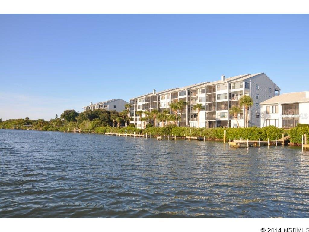 Beautiful direct riverfront corner unit in small complex that features boat dock, boat launch & easy access to car-free beach.  Granite & stainless kitchen.  Granite baths.  Two separate porches overlooking the river. Waterviews from all rooms.  Kitchen & guest bdrm enjoy river & ocean views.   Master suite opens to private riverfront balcony.  Livingroom opens to screened riverfront porch.  Offered fully-furnished (a few items excluded)  turnkey, absolutely gorgeous!  Deeded garage.   Enjoy County park close-by with volleyball, basketball & playground, too. ;LocationDescription: Condo ;Water: City