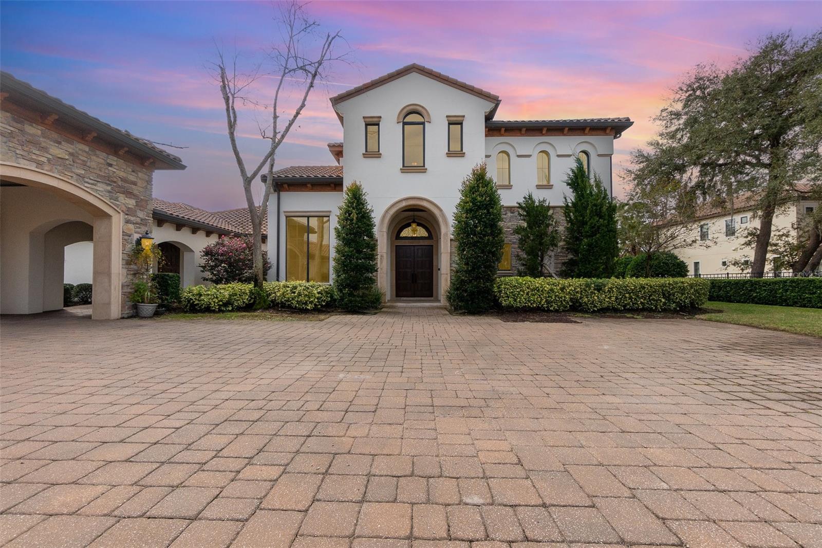 One or more photo(s) has been virtually staged. Welcome to Your Dream Home!

This stunning 4-bedroom, 4.5-bathroom estate with an oversized 6-car garage is a private gated retreat nestled in the beautiful Lake Nona area. Set on an expansive 2.5-acre lot with over 6,200 sqft of meticulously crafted living space, this home offers unparalleled luxury, elegance, and functionality.

Interior Features: • Gourmet Chef’s Kitchen: A culinary masterpiece featuring stainless steel appliances, granite countertops, custom cabinetry, a hidden pantry, and a spacious island. • Luxurious Primary Suite: Located on the second floor, the primary suite offers a custom-built walk-in closet with a secondary laundry area and clothes steamer, stunning wood-beamed ceilings, and a spa-like ensuite with dual vanities, a makeup station, jacuzzi tub, and walk-in shower. Step onto your private balcony and savor breathtaking sunsets over Lake Whippoorwill. • Open Floor Plan: Sunlit living and dining areas boast soaring ceilings and panoramic waterfront views. • Additional Features: A secondary primary suite on the first floor, elevator, motorized boat lift dock, jet ski dock, and an oversized 6-car garage with a built-in workstation, outdoor kitchen, and a hidden safe room.

Exterior Features: • Lakeside Living: Relax on the covered lanai or private dock, enjoying tranquil views of Lake Whippoorwill. • Professionally Manicured Grounds: The lush landscaping creates a serene and picturesque setting. 

Prime Location: Conveniently located just minutes from Disney, top-rated schools, world-class shopping, dining, and major highways, this home perfectly balances luxury and accessibility.

Don’t miss your chance to own this waterfront masterpiece in one of Orlando’s most sought-after neighborhoods. Schedule your private showing today!