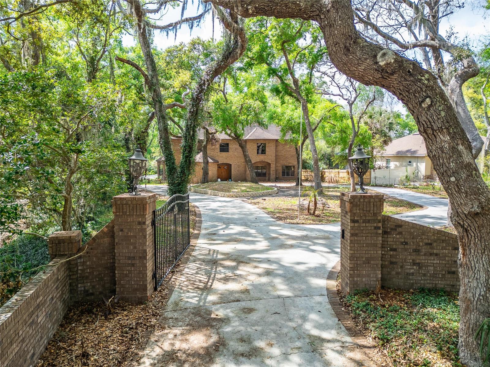4 bedrooms, 3 full and 2 half baths, Indoor Pool/Spa, Elevator, 2 Fireplaces, Wet Bar, and Gated 
Circular Driveway at the end of a quiet cul-de-sac. This is an extremely unique floor plan (bedrooms are creatively situated within the upstairs floor plan). This property sits on over an acre with 138 feet of Alafia River 
frontage, with a walking trail back to the Private Dock and Riverside Deck where you can 
canoe/kayak/paddleboard or just enjoy your peaceful mornings. 4 + car garage (1000 + sq ft) 
with a mechanic's pit. Solid oak double door entry way leads into the two-story marble foyer, 
where you are enveloped in rich craftsmanship and architecture. Intricate solid oak detailing, 9’ 
Ceilings, 5.5” Baseboards and luxury finishes throughout. Dining room is adorned with a 
custom-built oak China cabinet. The heart of the home is a chef’s dream kitchen, equipped with a 
Sub-Zero refrigerator and freezer, induction cooktop with anti-scratch matte glass, granite 
countertops, a center island, walk-in pantry, and a spacious eat-in area. The family room features 
a cozy wood burning fireplace, custom-built oak shelves and cabinetry, a wet bar with ice maker, 
sink, frig, built-in blender and a surround sound system. Two 3-panel sliding glass pocket doors 
vanish to reveal the enclosed Atrium with solar heated (15x30) Indoor Pool & Spa. This indoor 
oasis is set under a two-story vaulted ceiling with skylights and includes an outdoor kitchen, 
complete with gas grill, Thermador hood, refrigerator, and sink and access to a full bathroom 
making this area ideal for year-round entertaining. Ascend by elevator or stair to the spacious 
owner's suite, a 17x20 retreat with dual cedar-lined walk-in closets and a European spa-style 
bath, featuring dual vanities with sinks and a central walk-in shower. Adjoining the suite is a 
spacious flex room with its own fireplace, ideal as a private lounge, nursery, or 4th bedroom. 
Glass doors lead to a balcony overlooking the pool/spa atrium below. A second bedroom suite 
includes dual built-in closets, a private en-suite bath with dual vanities with sinks, and a step-in 
shower. An upstairs laundry room and a fourth-bedroom or versatile flex room round out the 
second floor. Modern Light Fixtures & Granite Countertops, Updated Pool Pump & Upgraded 
Water Heaters (2) Newer AC's (2022). Once-in-a-lifetime opportunity to own a secluded riverfront 
residence.