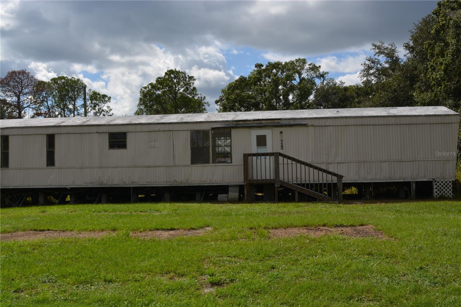 Nearly 1 Acre with Existing 3-Bedroom Manufactured Home – Endless Possibilities! This unique 0.93-acre AS-1 (Agricultural) property offers endless possibilities for investors, builders, or buyers looking for affordable acreage in desirable Valrico. The property includes an existing 3-bedroom, 2-bath manufactured home that is currently livable but would benefit from repairs and updates. Whether you choose to renovate, live in it while planning your future home, or utilize it during construction, this home provides immediate functionality and added value. 
The property is equipped with water and electricity already in place, representing significant savings for the next owner. With no HOA and flexible AS-1 zoning, you'll have the freedom to build your dream home, establish a small farm, create a homestead, or invest in a property with long-term potential.
Enjoy the peace and privacy of country living while remaining just minutes from shopping, dining, schools, and major highways for an easy commute. Opportunities like this are becoming increasingly difficult to find. Schedule your showing today and explore the possibilities this versatile property has to offer.