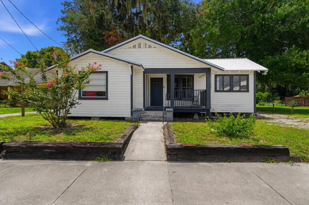 Welcome to this RARE opportunity to own a fully occupied, cash-flowing investment property just one mile from the University of Florida! This property offers a total of 5 bedrooms and 5 bathrooms with over 1,700 square feet of heated and cooled living space and is currently generating $4,200 per month in gross rental income. The main home features 4 bedrooms and 4 full bathrooms, while the attached studio offers a separate private entrance, full bathroom, and kitchenette - the perfect setup for a short-term rental opportunity. Step inside the main home and you’ll appreciate the newly installed luxury vinyl plank flooring, fresh interior paint, updated fixtures, and a beautifully renovated kitchen complete with shaker-style cabinetry, granite and butcher block countertops, and stainless steel appliances. All five bathrooms have also been tastefully renovated. Additionally, the studio has been updated with a refreshed kitchenette, new LVP flooring, fresh paint, and a gorgeously renovated bathroom. Additional updates include: new water heater, new HVAC system, new mini split in studio, and a newer roof (2023). Listed at $395,000, this property exceeds the 1% rule many investors are after, making it an attractive opportunity for anyone looking to add a strong income-producing property to their portfolio. Give us a call today to schedule a private tour!