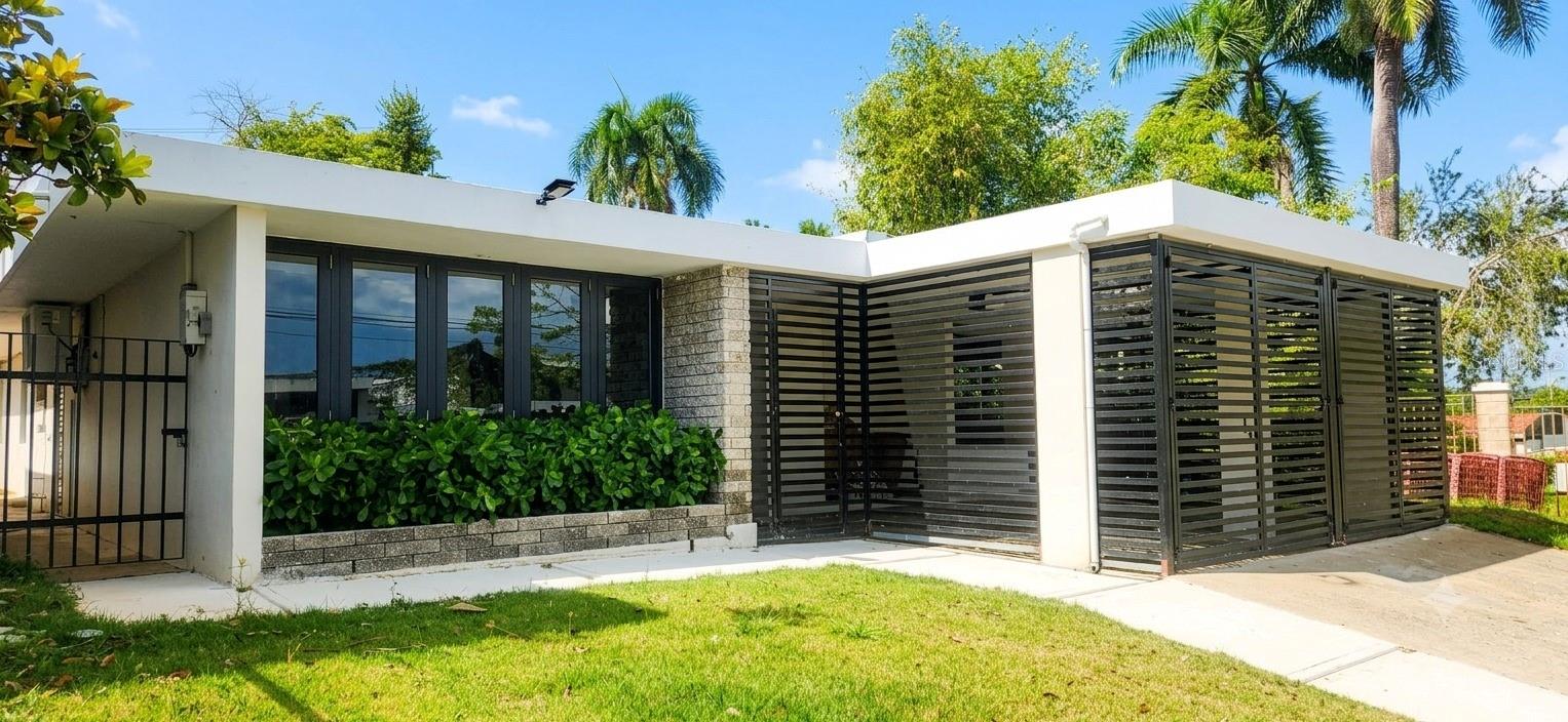 Exclusive and modern fully remodeled residence in a prime location on Avenida Lopategui, Guaynabo. This stunning property features 4 spacious bedrooms, including an impressive primary suite measuring approximately 27’ x 18’, 2 spa-inspired modern bathrooms, elegant living and dining areas, spacious family room, and a contemporary open-concept kitchen with direct access to a cozy terrace and backyard perfect for entertaining and family gatherings.

The kitchen showcases elegant granite countertops and comes equipped with a brand-new stove, refrigerator, and built-in oven combo. Bright open spaces, glossy porcelain floors, modern windows and doors,  finishes throughout create a luxurious yet welcoming atmosphere.

The property also offers a double carport, two driveways, and an excellent floor plan designed for comfortable living. Centrally located just one minute from Avenida Esmeralda and Camino Alejandrino, with quick access to PR-177, PR-199, and Martínez Nadal Expressway. Close to top schools, shopping centers, restaurants, and more.