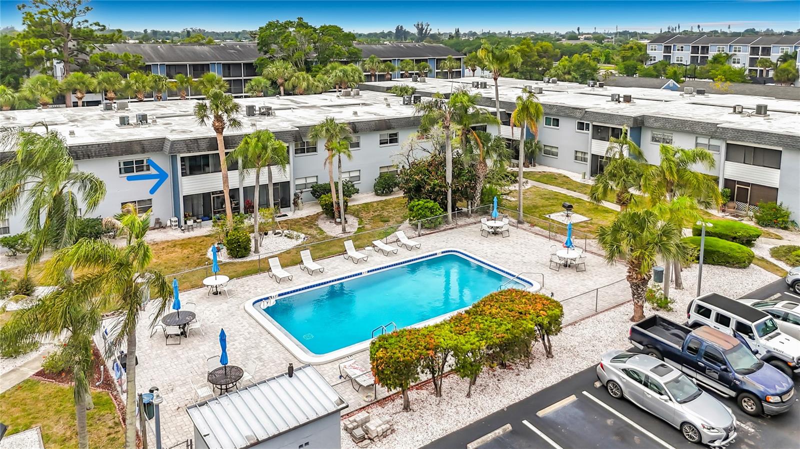 PRICED TO SELL! BEAUTIFUL second floor 1 Bed, 1 Bath condo with a view of the community POOL in the popular Fountain Lake condominium community! UPDATED Luxury Vinyl flooring just installed in the entrance, kitchen and living area! This condo has a well designed floor plan with a nice sized multi purpose space when you enter that is currently being used as a home office. The kitchen has plenty of storage with cabinets on both sides, a convenient pass through counter to the dining/living area and beautiful NEW luxury vinyl flooring. The primary bedroom has an ensuite bathroom and nice sized walk in closet. Lots of natural light from the patio slider doors keeps the freshly painted living area bright! There's a screened in covered balcony to relax in that overlooks the sparkling pool while you enjoy the warm breezes and view of the lush tropical landscaping. Have fun with family and friends in the community pool while you cook up your favorite foods in the grilling area just steps away. PLUS 2 pets are welcome here! Fountain Lake Condominiums are in a perfect location close to sandy beaches, great shopping, top notch colleges, Sarasota Airport and much more! Why rent when you can OWN this WONDERFUL condo in sunny Florida at a fantastic price!