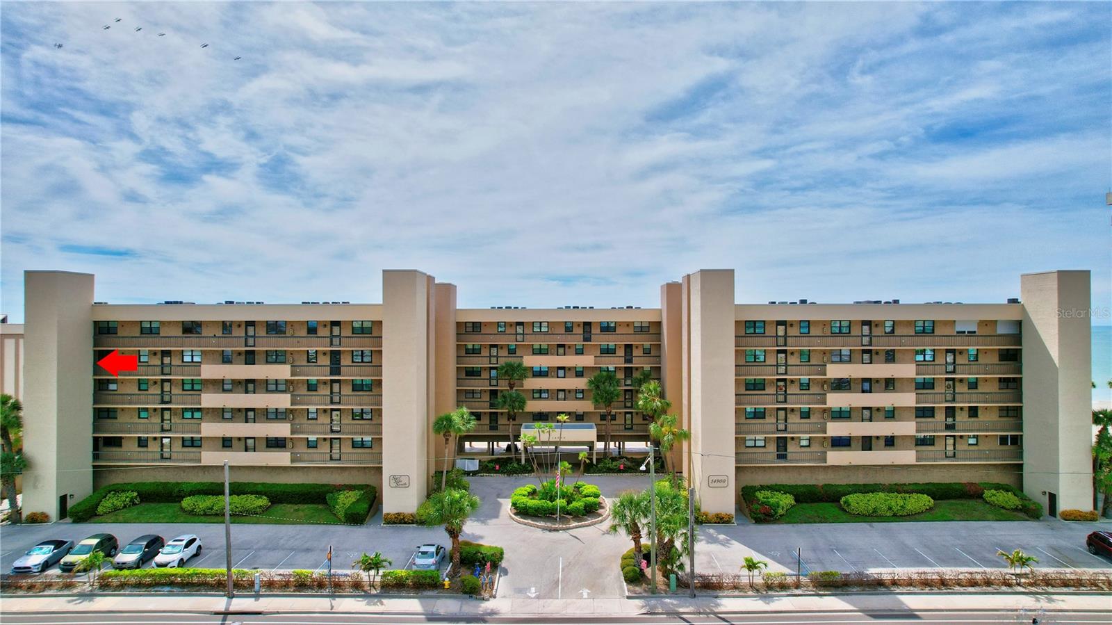 Welcome to your dream coastal retreat! This lovely 2-bedroom, 2-bathroom CORNER UNIT offers the perfect combination of luxury, convenience, and serene beachfront living. Boasting mesmerizing views of the Gulf, this condo is ready to be updated any way you please adding your very own personal touches. This is one of the few units that has a full WRAP-AROUND PORCH and floor to ceiling windows at both the West and South orientations of the building providing an abundance of natural light. The hurricane shutters are electric operated. As you enter the unit, you’ll notice the beautiful beveled edge TRAVERTINE MARBLE FLOORS that cover the main living areas. Each bedroom has its own updated en-suite bathroom with newer granite countertop vanities. The kitchen is original, completely functional in its as-is condition, and waiting for you to customize it to your liking. This END UNIT is also one of the few that has a BONUS ROOM adjacent to the kitchen with electrical running to it. It could be used as an eat-in den, additional storage, or office space. You could very easily move the washer and dryer (currently in the kitchen) into this bonus space in order to expand the kitchen countertop and cabinets. The decision is yours! 2021 ELECTRICAL PANEL updated to the latest electrical standards. HVAC was replaced in 2018 and owner has it serviced every year. Other community features include heated pool and spa with beach views, private dedicated parking space with plenty of guest parking, elevator access, secure key access to the building, pet-friendly community (see association rules), 30-day minimum rental policy for great income potential (see association rules). This is a well-managed community. The roof was recently redone as well as the milestone inspection and reserve study. Maintenance-free living with spectacular sunset views and direct access to the magnificent Gulf of Mexico. What could be better! Easy access to John’s Pass, restaurants galore, public parks, grocery stores, hospitals. You will never run out of things to do! Schedule a showing today to take a look at this little slice of paradise.
