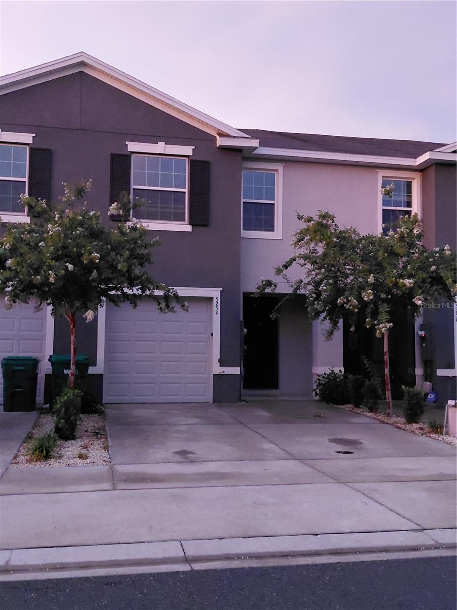 THIS TOWNHOME IS PRICED FOR IMMEDIATE SALE! READY TO MOVE IN! This Beaumont Townhomes community is in Wildwood and minutes away from The Villages Lake Sumter and Brownwood Paddock Squares. The foyer opens up to the spacious first floor with ceramic tile throughout and has a powder room/half bathroom as soon as you walk in! The open kitchen features smooth granite counters and stainless-steel appliances, as well as a walk-around island. Also included is a generous sized walk-in pantry. There is newly installed carpeted stairs and bedrooms on the second floor, you'll find The main bedroom to your immediate right that has two walk-in closets and a private bathroom with twin sinks and a modern step-in shower. Loads of closet space in all the bedrooms!! There's even an extra closet for linens in the hall. The second bathroom has a tub and shower combo for whichever you'd prefer. The laundry room includes upgraded built in solid wood shelving. With a wall for privacy and no back neighbors, its very nice to sit on the lanai and enjoy the Florida sunshine! Conveniently located right across from the guest parking spots and just a quick 2 minute walk to the community pool just around the corner - you've got everything you need here to enjoy company and relaxation. Lawncare is included in the HOA so you don't even have to worry about that! This is a smart home, with a video doorbell and an app that can lock the front door, open the garage door, change the home temperature and turn on lights. Please call today to schedule your own private tour of this beautiful townhome!