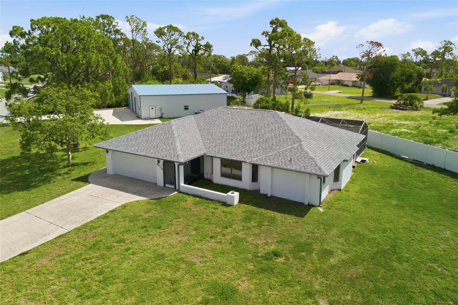 Time to Start Living the Florida Lifestyle.... Gulf Cove is one of the most sought after Waterfront Communities in Port Charlotte.  This Affordable 3 Bedroom, 2 Bath, 2 Car Garage Pool Home on 3 Lots with a Huge Detached Garage/Metal Building that boost over 2400 sf under air, with separate furnished apartment approximately 560 sf with full kitchen, living room area, one bedroom and bathroom and laundry room combo with tankless hot water heater is a must on your list of homes to see.....
The main home features: spacious living room/dining room with pocket sliding glass doors out to your private swimming pool/lanai, centrally located is the kitchen with breakfast bar, closet pantry, sliding pass through window overlooking the pool, all appliances included...dinette area or could be office area just off the kitchen with sliding glass pocket doors out to the lanai....plus a huge family room featuring vaulted ceiling.  Split floorplan.  Primary bedroom is spacious with two walk-in closets with pocket sliding glass doors out to your lanai/pool.  The primary bath has a long vanity with plenty of storage and  glass door enclosed walk-in shower with nice tiles. Both guest bedrooms off the family room are good size rooms with walk-in closets.  Guest bathroom features long vanity with sink, tub/shower and door out to your private pool.  Brand New Roof Just Installed June 2026. 
Plenty of room to entertain with your large screen/covered lanai....relax by your private swimming pool.
The Detached 4+ Car Garage/Workshop/Mancave on concrete slab has 3 roll up doors (2- 10x8, one in middle 10x12), insulated and fully under air with it's own 5 ton  A/C unit. There is approximately 1824 sf of parking area with room for RV/Boat and built-in hose system for your own air compressor.  Back left side has stairs up to loft area for more storage area or could be another room.  The separate furnished apartment to the back right has it's own 2-ton A/C unit.
Gulf Cove Waterfront Community has optional HOA.  If you choose to participate, a low yearly fee grants you permission to use the private boat ramp and private community park.  
Plenty to do in the area including:  Boating & Fishing, Nature & Biking, Beach Hopping & Sunsets, Golfing, Dining & Local Events and more... Nearby beaches are as close as 15 minutes away....with one of the world-class beaches of Boca Grande on Gasparilla Island.
Paradise awaits..... Call today for your private showing.