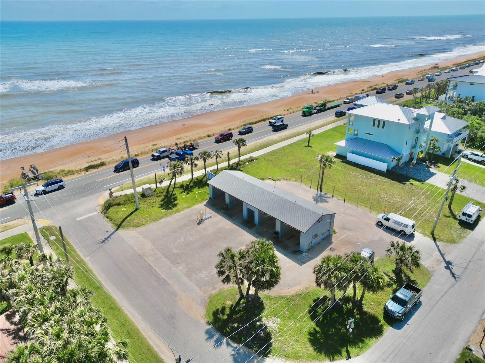 Double lot. Great investment directly on A1A -Single Family Home, Short Term Rentals allowed (multi-unit allowed) example 15 units at 750sf ,3 story 35 ft height restriction. 1. Motels and hotels. 2. Bed and breakfast inns. 3. Restaurants. 4. Gift shops. 5. Convenience commercial uses such as: a. Beauty or barber shops. b. Laundromat, laundry and dry cleaning pick-up stations. c. Convenience Store. D. Off-street parking and loading. Car Wash currently on property.