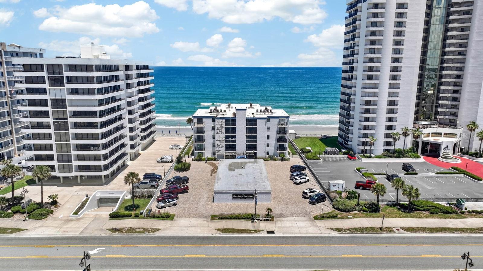 A rare opportunity to own a DIRECT OCEANFRONT condo is finally here! This beautifully updated unit in Danbury Breakers features brand-new hurricane-rated windows and sliding glass doors, offering both peace of mind and breathtaking coastal views. Sold fully furnished and completely turnkey, this condo is ready for immediate enjoyment or investment potential. Enjoy resort-style amenities including an oceanfront pool, shuffleboard, gazebo, and convenient laundry facilities on every floor. With a 2-week minimum rental policy, this property offers excellent flexibility for personal use or rental income. Owners may have pets, while renters are not permitted pets. Wake up to the sound of the waves, soak in the ocean breeze, and start living the beach lifestyle you've always dreamed of today!
