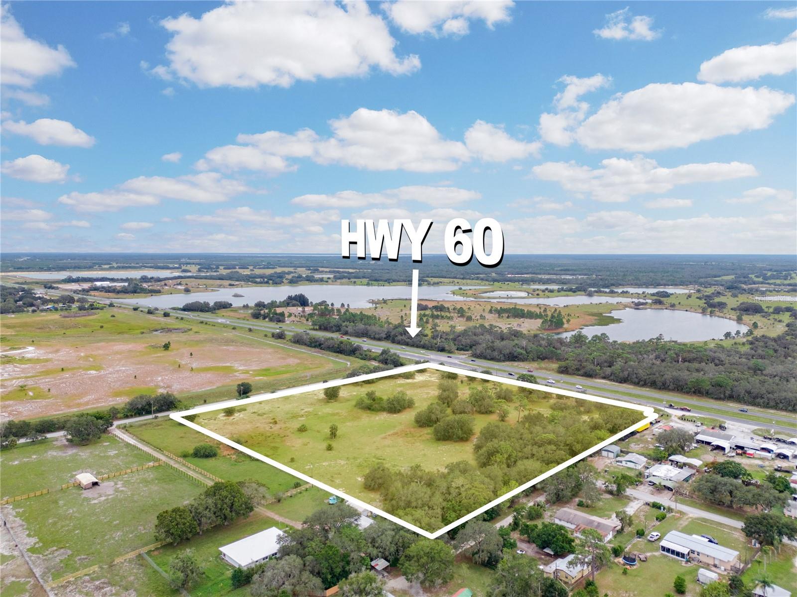 10.96 +/- Acre corner lot, vacant land, with premium frontage on State Road 60 in Lake Wales. This amazing site is situated just outside of the city limits of Lake Wales and one of the few properties in the area with partial commercial zoning.
 
It is within close proximity to a number of high traffic stores and amenities. Only 2.5 miles to Walmart, 4.4 miles to Publix, 6.2 miles to Bok Tower, 5.3 miles to downtown Main St, and 7 miles to the local favorite- Crazy Fish. State Road 60 is the main thoroughfare across the State of Florida connecting The East Coast in Vero Beach to the West Coast in Tampa Florida directly through Lake Wales. With a traffic count of 19,900 cars per day according to the FLDOT, this site has premium visibility and would be a fantastic acquisition for an investor or entrepreneur. 
 
The lightly wooded lot has a front portion that is zoned CE (Commercial Enclave)  which allows for retail opportunities and even has a conditional use for a gas station. The rear portion of the lot is zoned RS (Residential Suburban) which allows for Single Family detached homes with a density of 1du/ 5 acres. 
The property has 4.5+/- acres of high and dry land while the remainder is positioned in Flood Zone A. 
Potential to rezone the property for one sole use pending a pre application process and Level 4 review with the county. 
Don't miss this incredible opportunity for development.